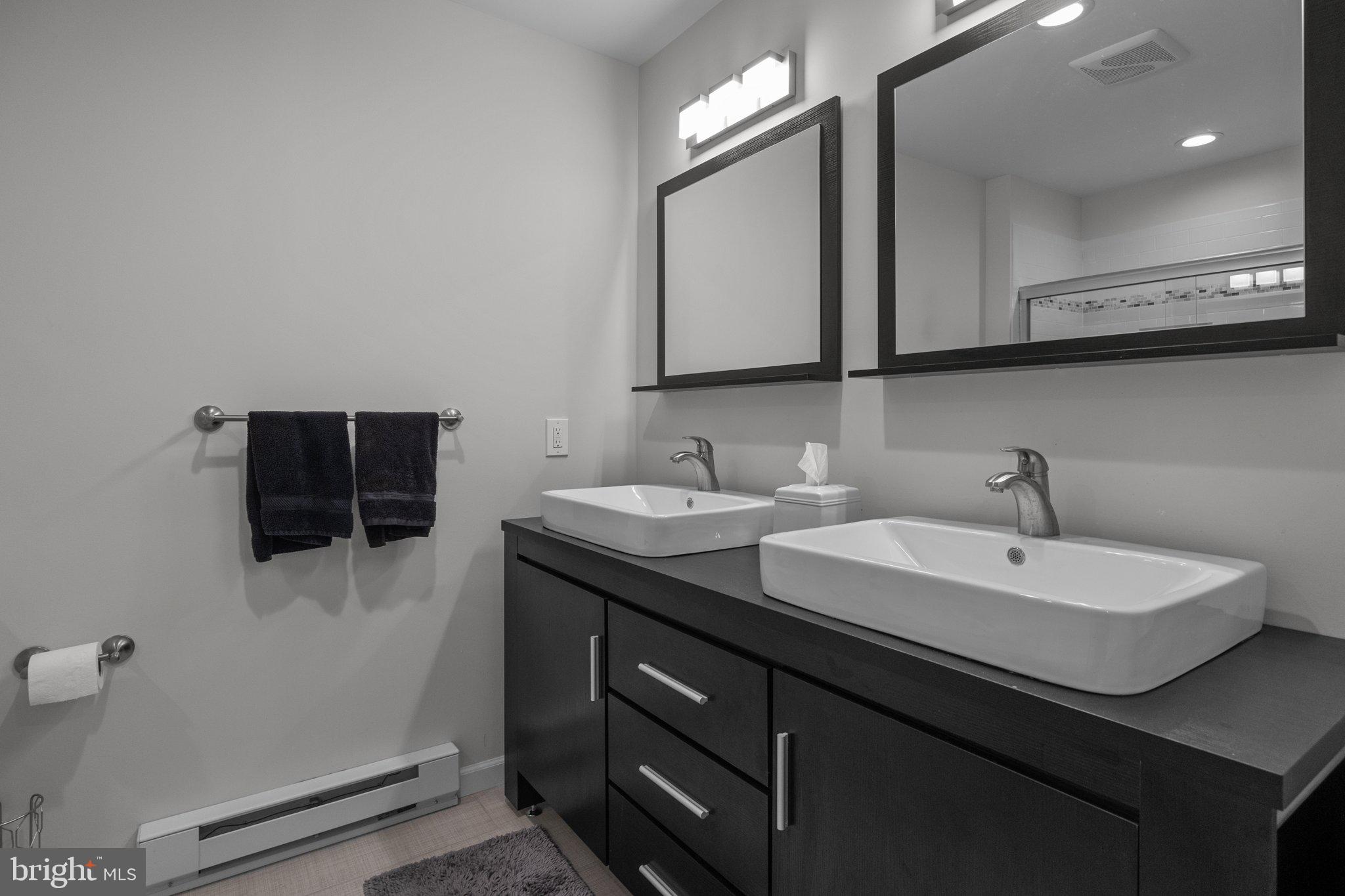 1615 Silver Birch Road Huntingdon Valley, PA 19006 - Photo 40 of 69 a bathroom with a double vanity sink and mirror