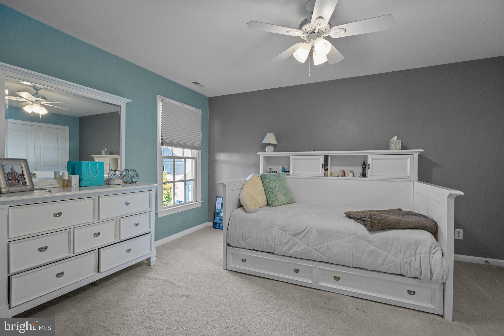 1615 Silver Birch Road Huntingdon Valley, PA 19006 - Photo 43 of 69 a bedroom with a bed a chandelier and a dresser