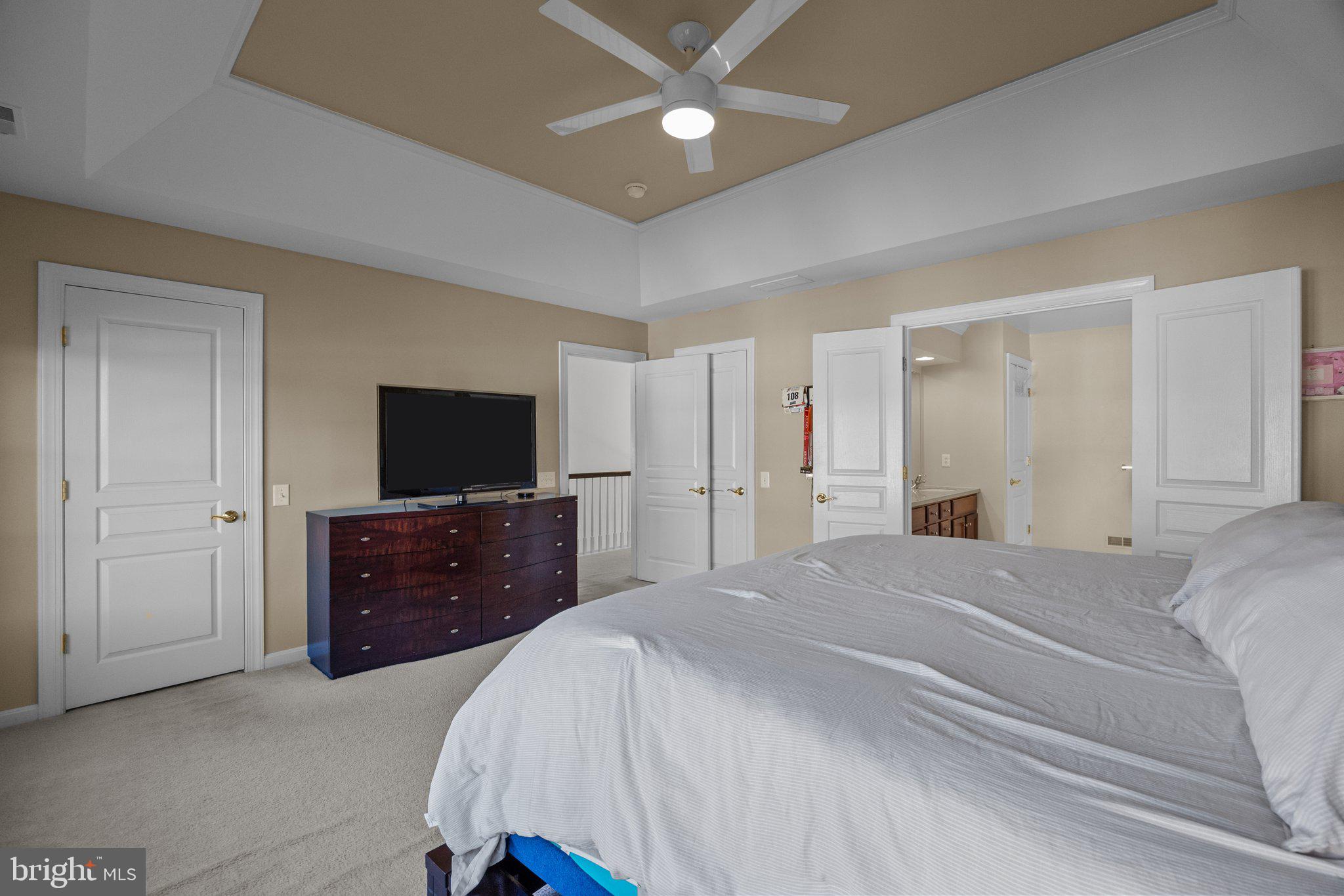 1615 Silver Birch Road Huntingdon Valley, PA 19006 - Photo 50 of 69 a bedroom with a bed and a flat screen tv on dresser