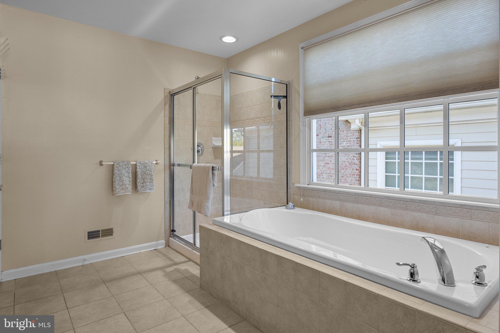 1615 Silver Birch Road Huntingdon Valley, PA 19006 - Photo 52 of 69 a spacious bathroom with a tub a sink and a shower