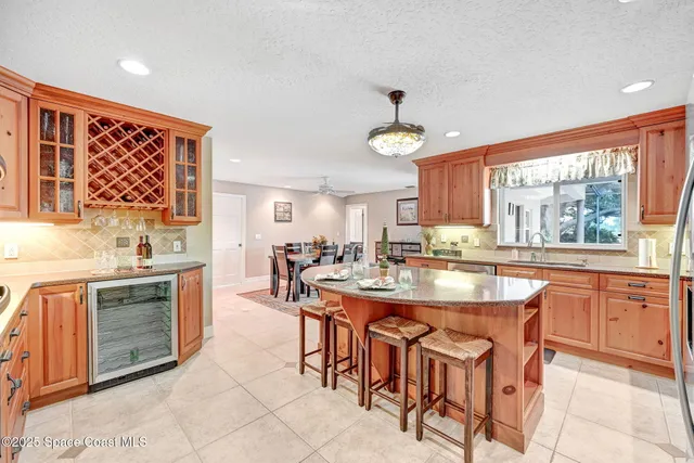 a kitchen with stainless steel appliances granite countertop a sink and cabinets