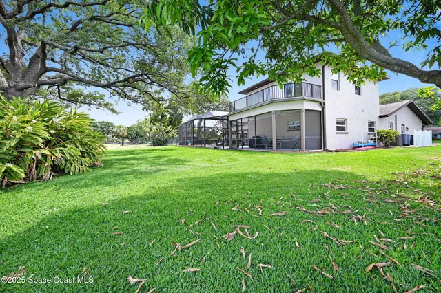 a view of staircase with white walls and a window