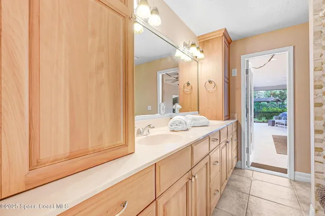 a bathroom with a tub a sink and a window