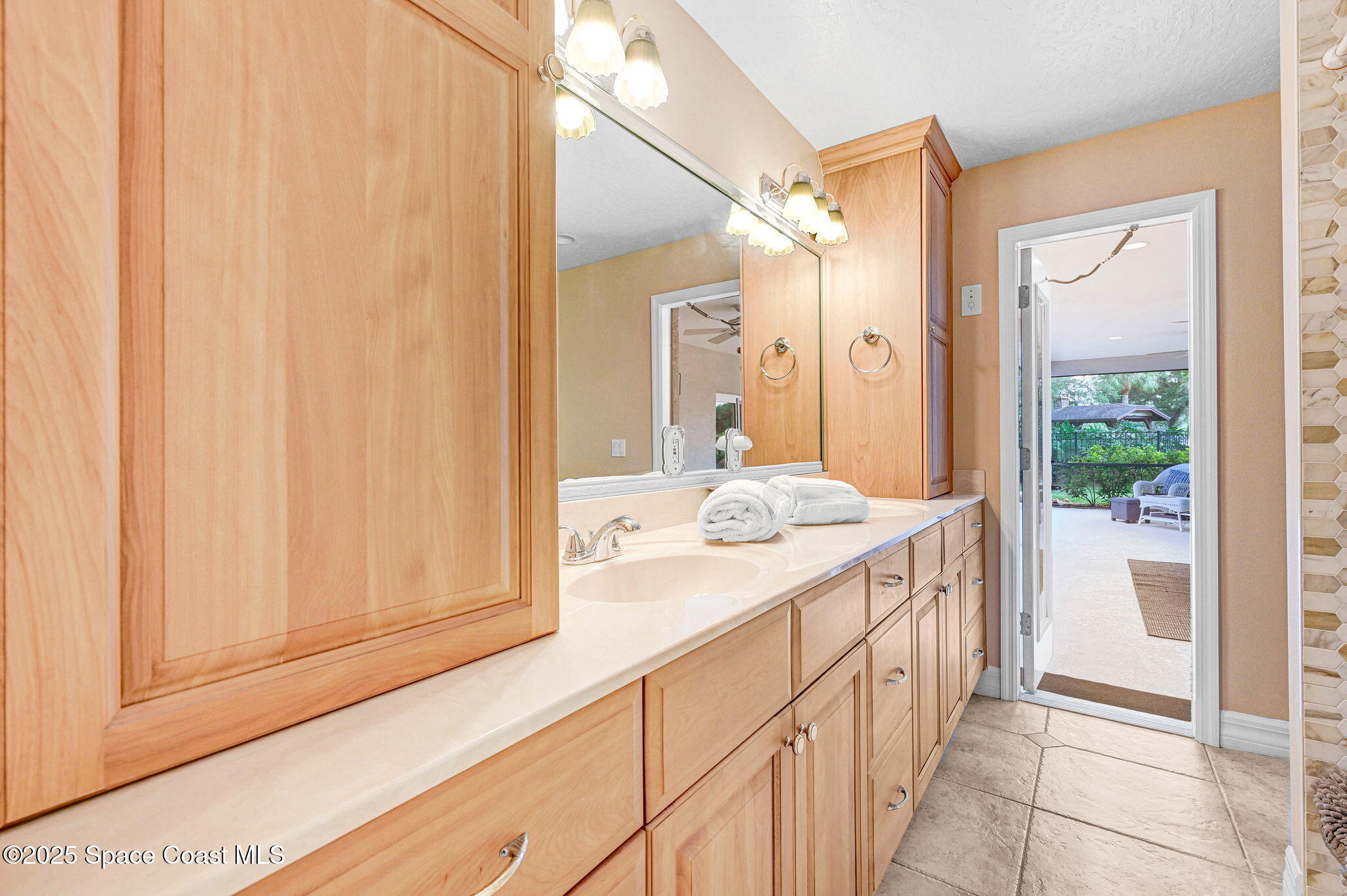 1428 Gleneagles Way Rockledge, FL 32955 - Photo 29 of 90 a bathroom with a sink and a mirror