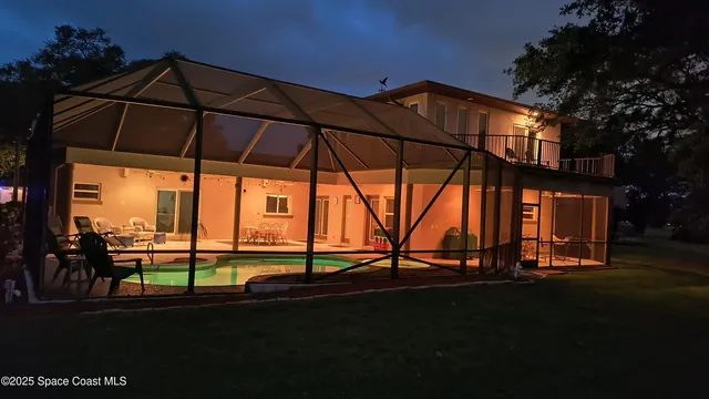 a bedroom with furniture and a flat screen tv