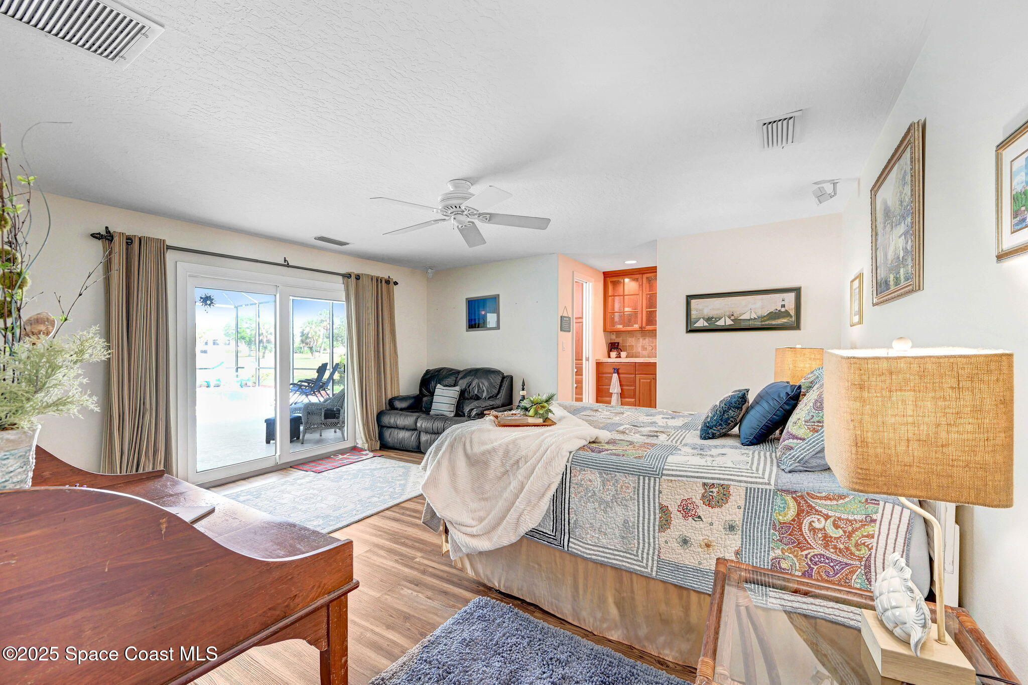 1428 Gleneagles Way Rockledge, FL 32955 - Photo 32 of 90 a living room with furniture and wooden floor