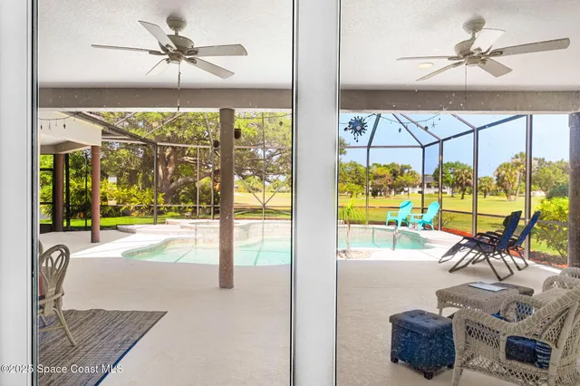 an aerial view of a house with garden space and street view