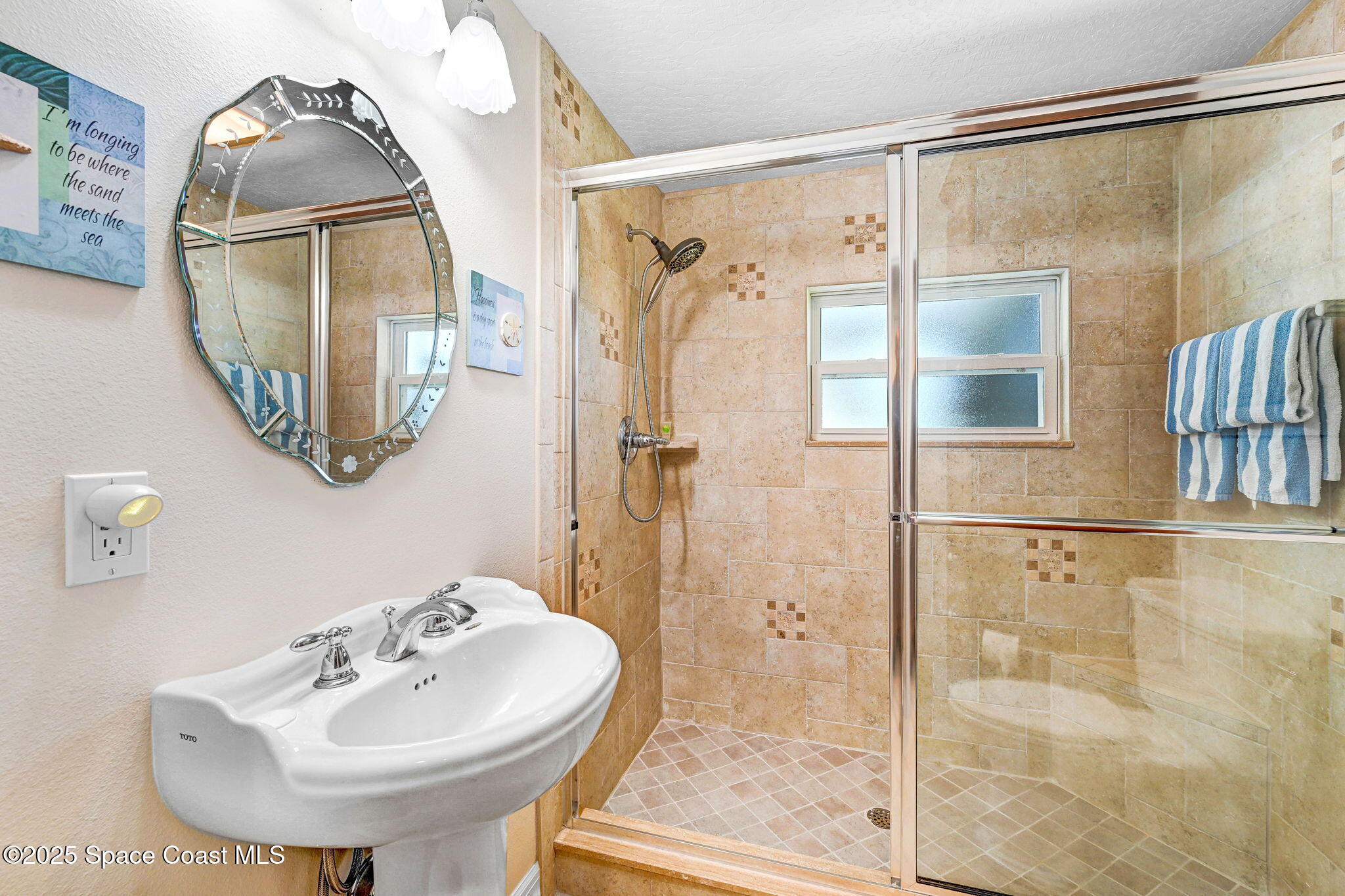 1428 Gleneagles Way Rockledge, FL 32955 - Photo 35 of 90 a bathroom with a sink shower and mirror