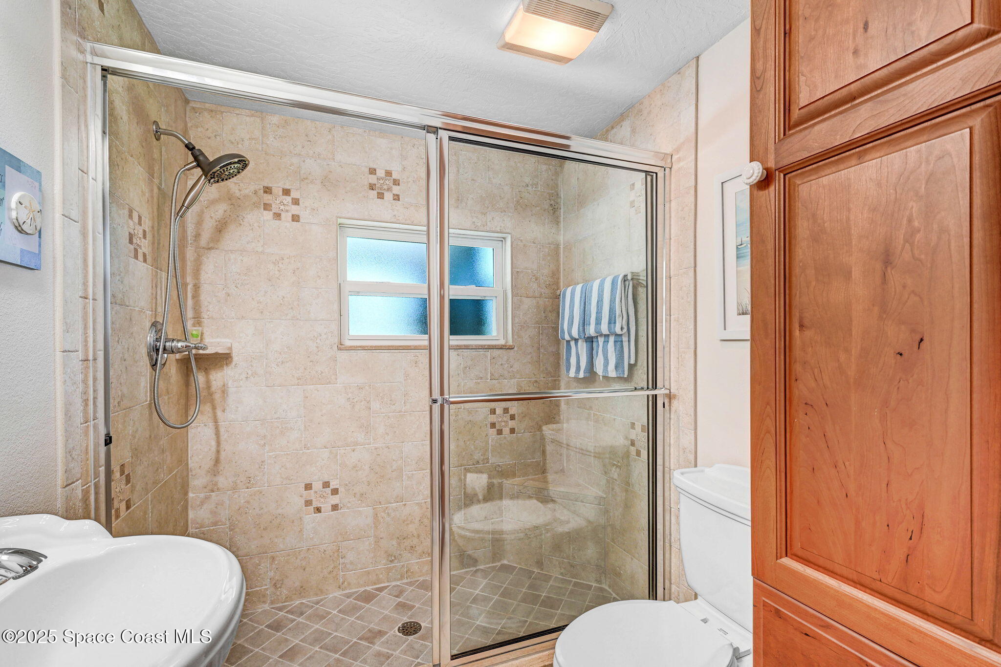 1428 Gleneagles Way Rockledge, FL 32955 - Photo 36 of 90 a bathroom with a shower and toilet