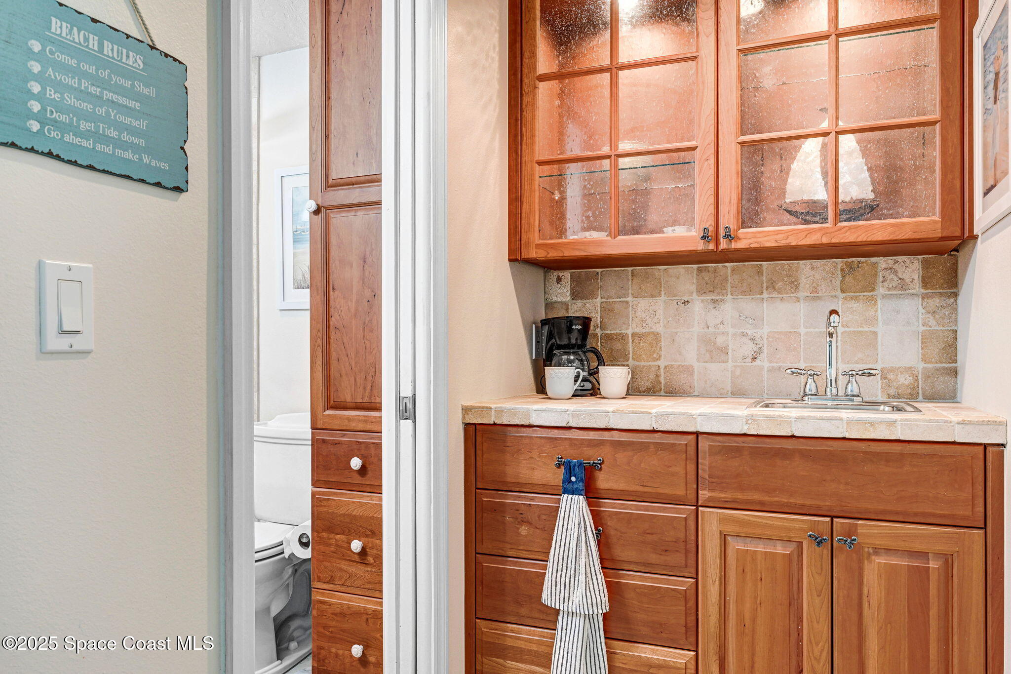 1428 Gleneagles Way Rockledge, FL 32955 - Photo 37 of 90 a kitchen with a sink and cabinets