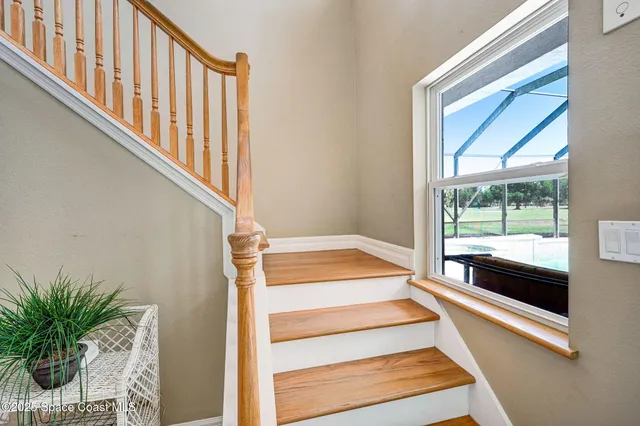 an aerial view of residential house with swimming pool