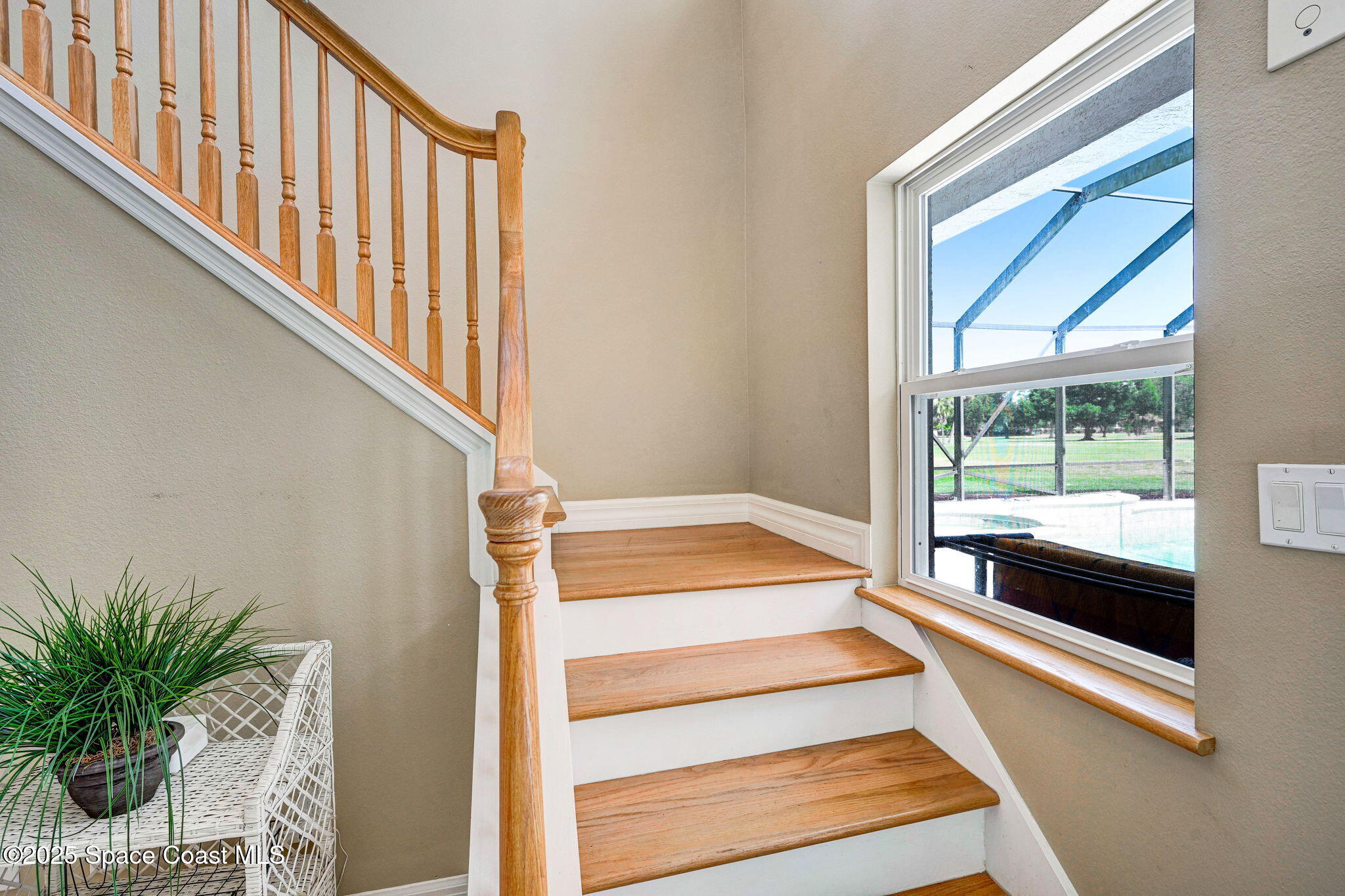 1428 Gleneagles Way Rockledge, FL 32955 - Photo 39 of 90 a view of staircase with white walls and a window