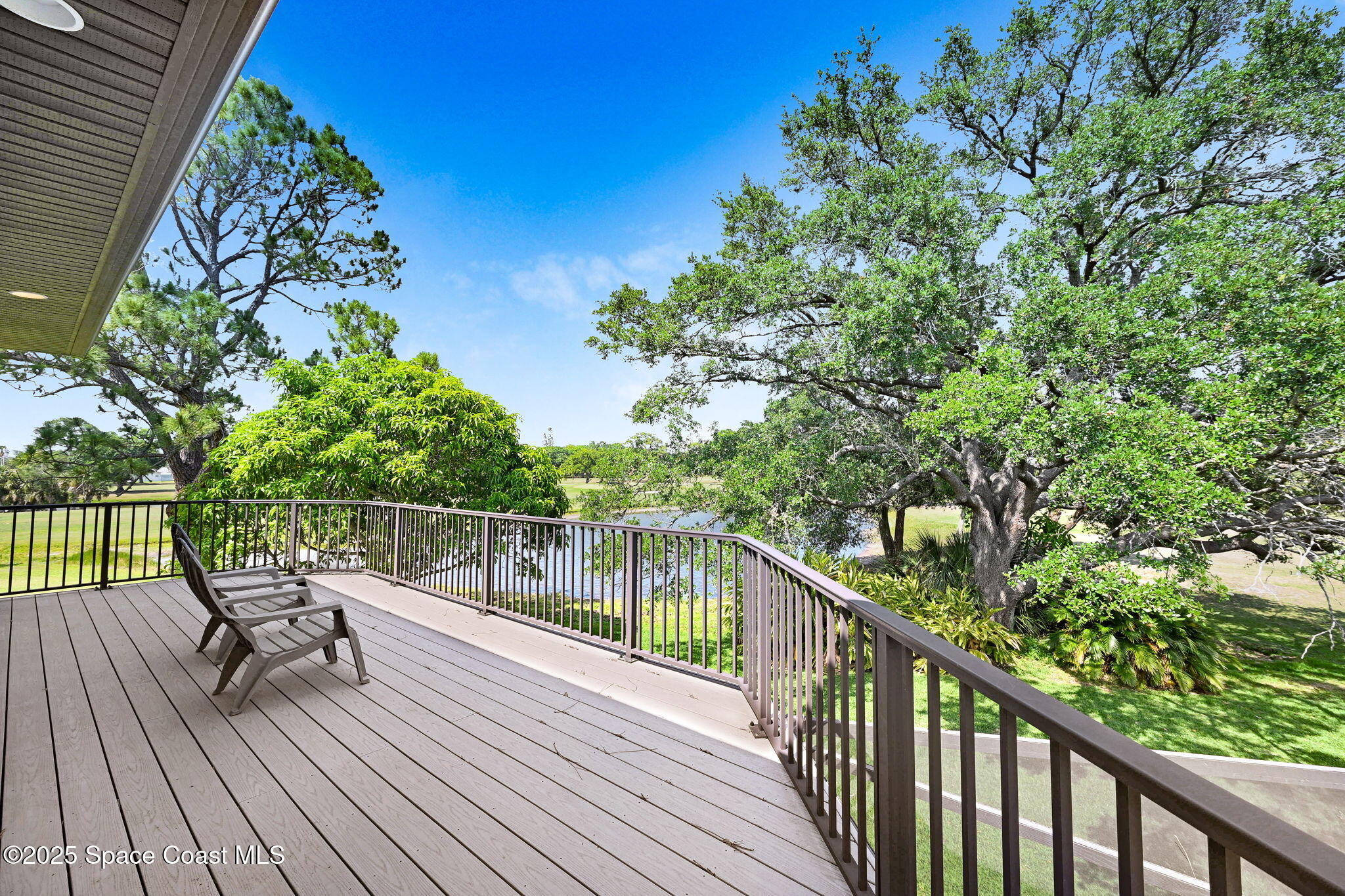 1428 Gleneagles Way Rockledge, FL 32955 - Photo 44 of 90 a balcony with wooden floor and stairs