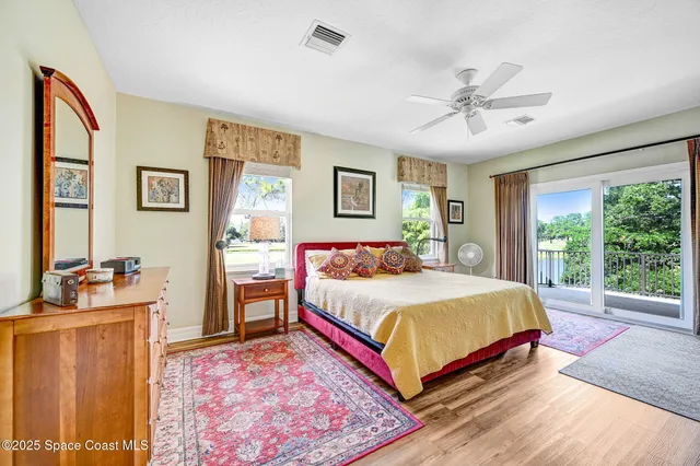 a dining room with stainless steel appliances granite countertop a dining table and chairs with the view of garden