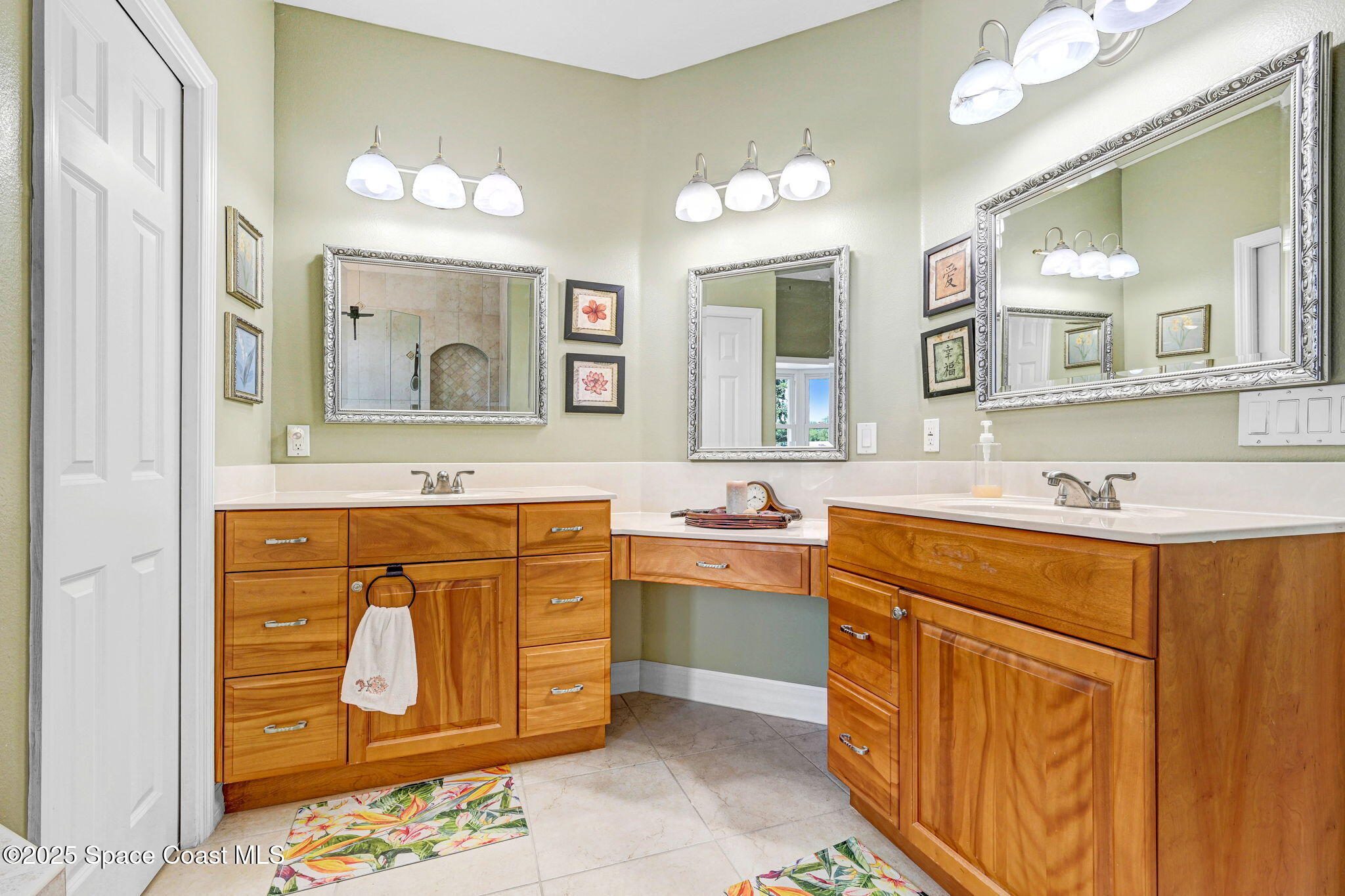 1428 Gleneagles Way Rockledge, FL 32955 - Photo 52 of 90 a bathroom with a sink a mirror and a vanity
