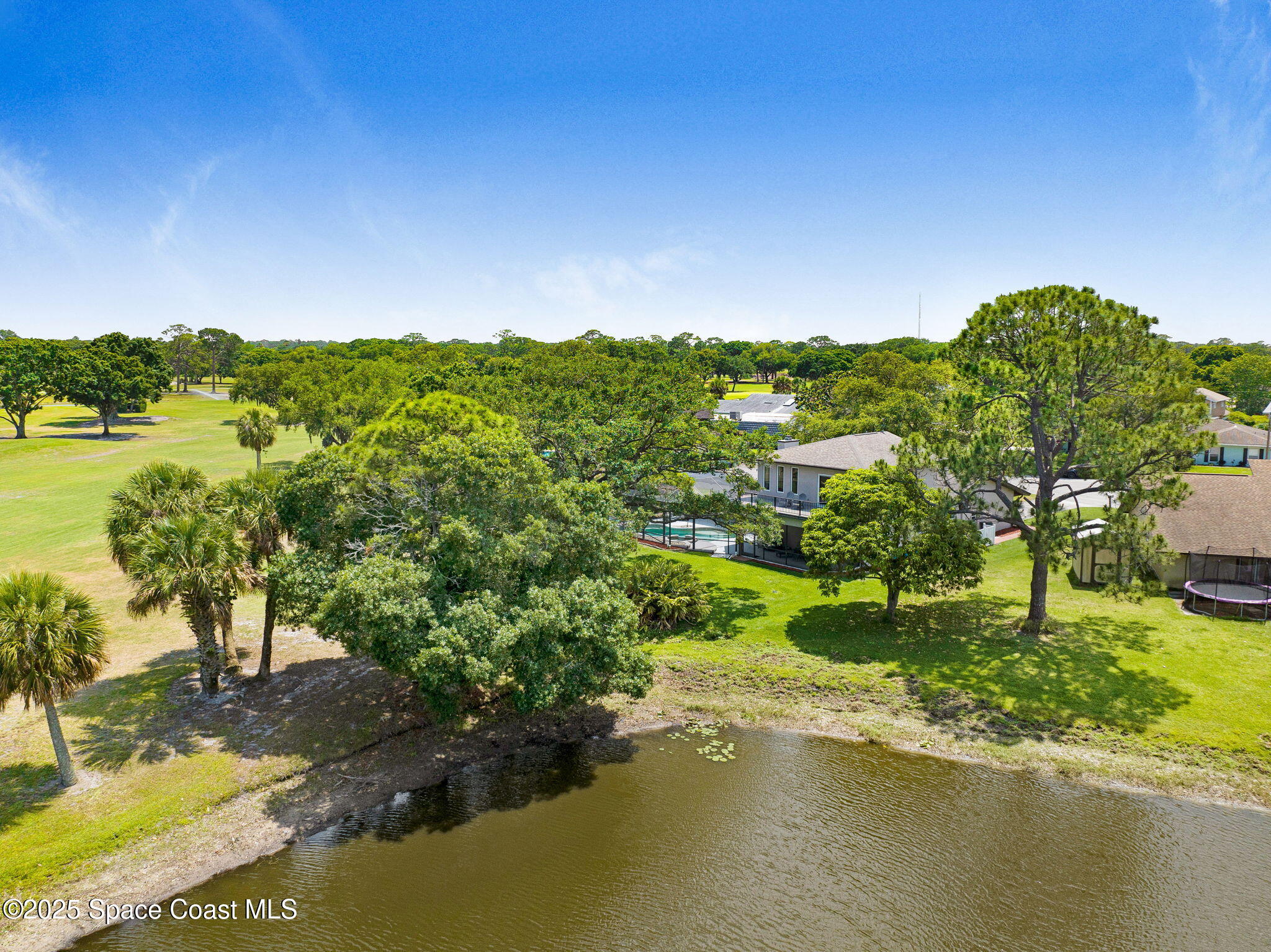 1428 Gleneagles Way Rockledge, FL 32955 - Photo 68 of 90 a view of a lake with houses