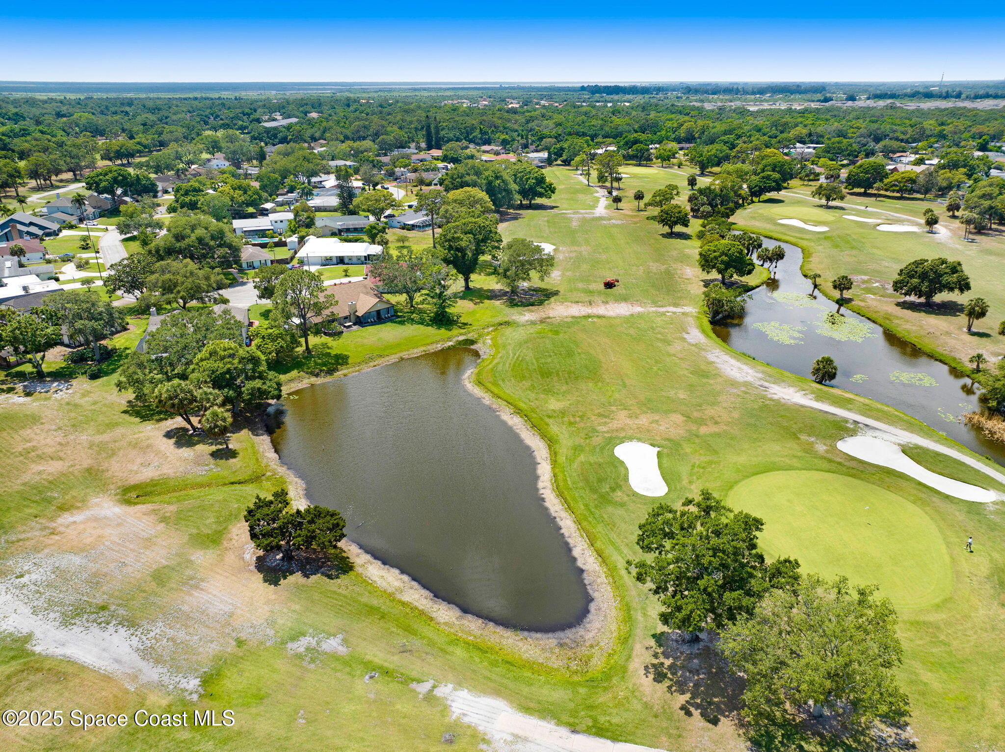 1428 Gleneagles Way Rockledge, FL 32955 - Photo 71 of 90 a view of a swimming pool and lake