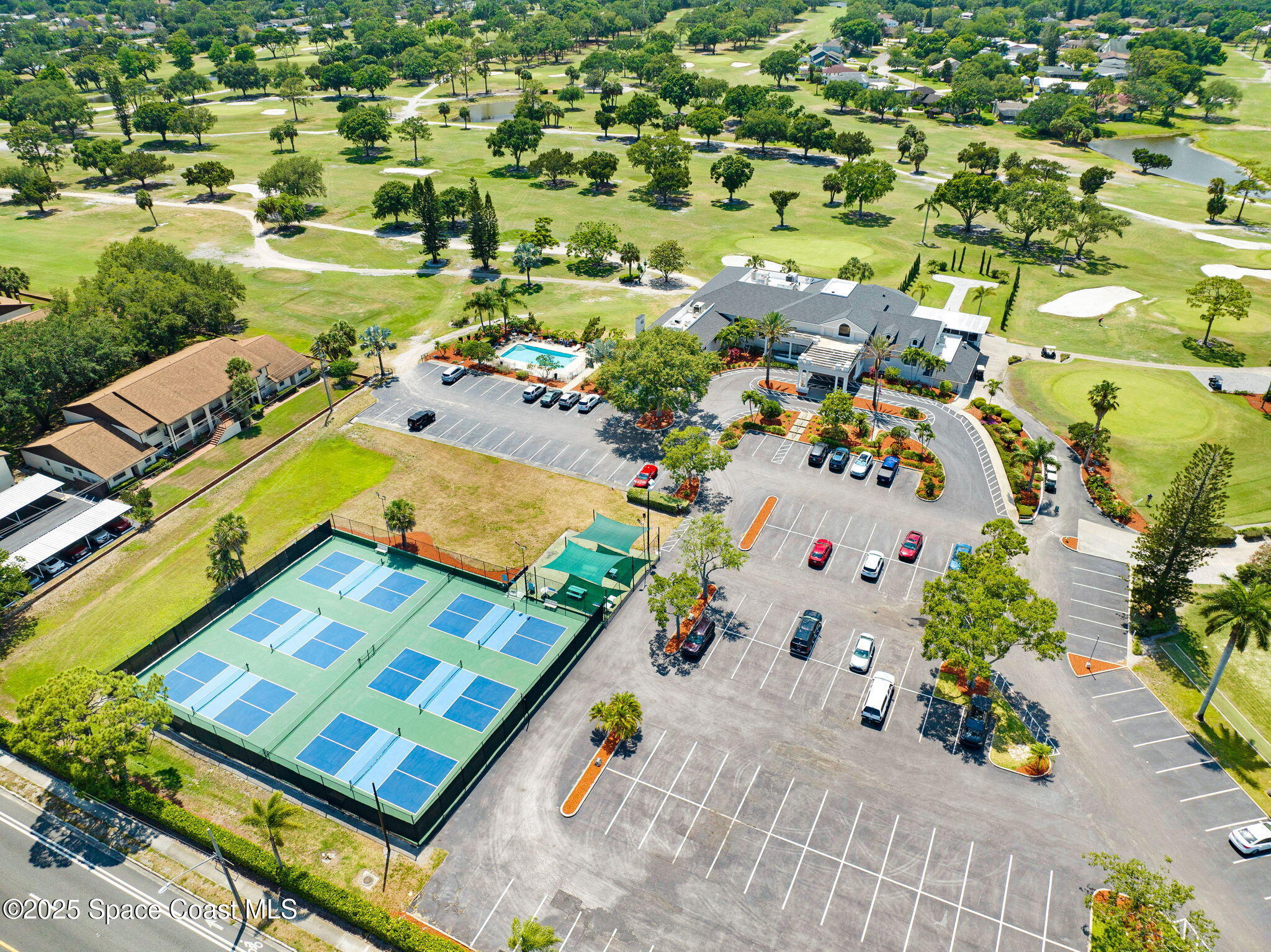 1428 Gleneagles Way Rockledge, FL 32955 - Photo 79 of 90 an aerial view of a pool yard and mountain view in back