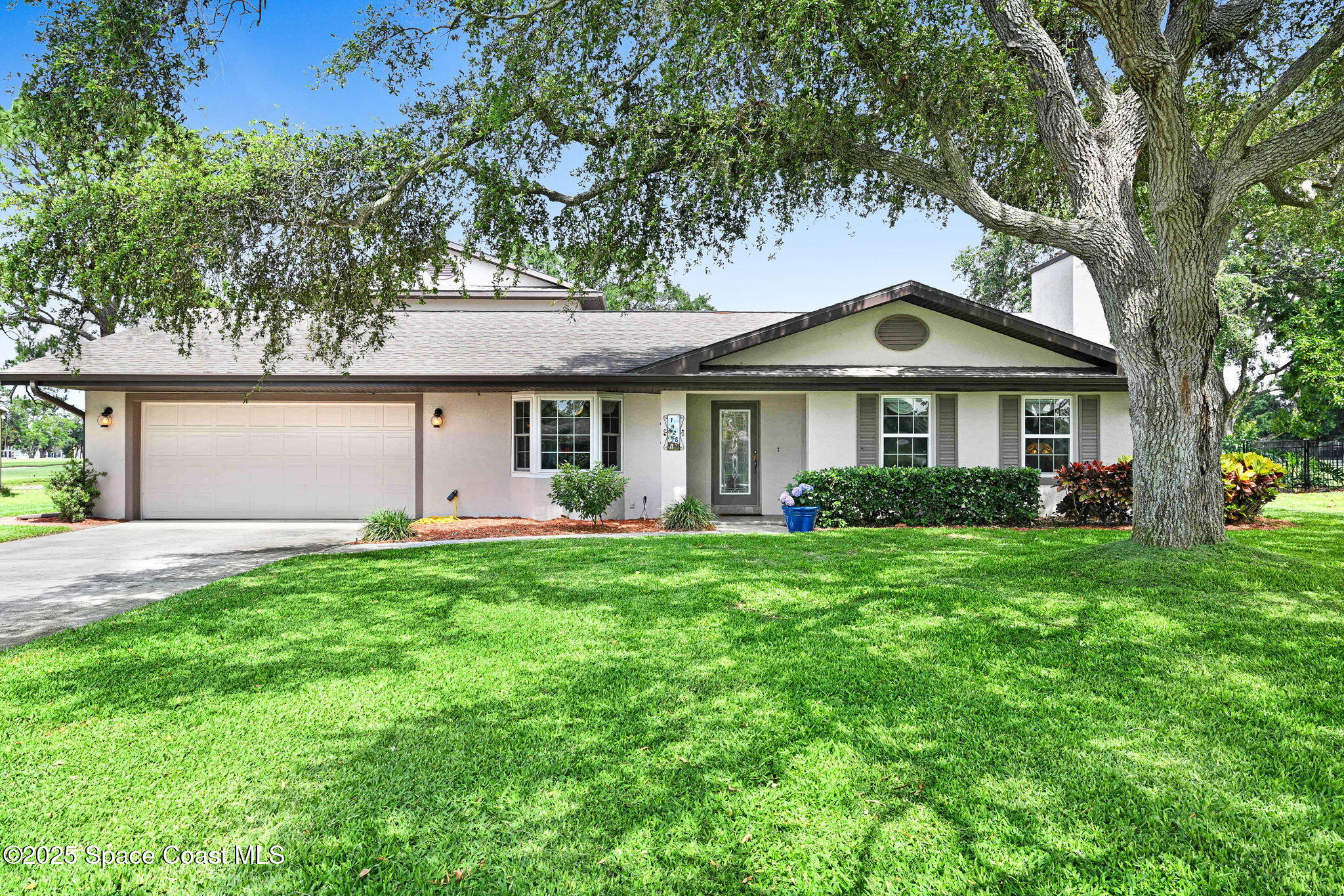 1428 Gleneagles Way Rockledge, FL 32955 - Photo 80 of 90 a front view of a house with a garden