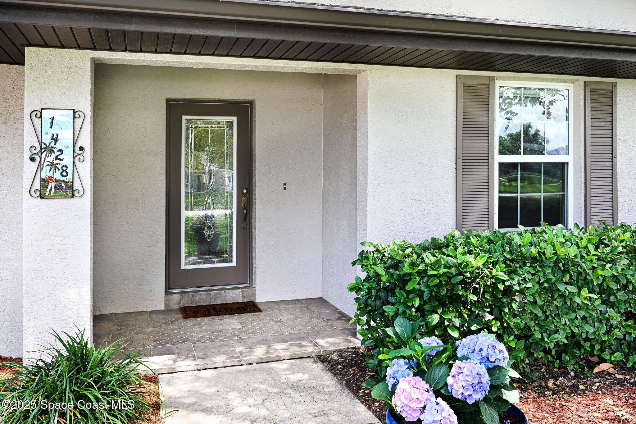 1428 Gleneagles Way Rockledge, FL 32955 - Photo 81 of 90 a view of a entryway door front of house