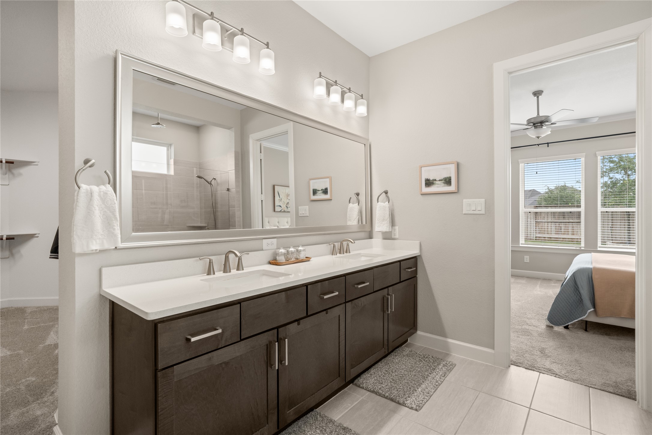3118 Swift Way Katy, TX 77493 - Photo 19 of 34 Primary Bathroom (Vanity) – Double vanity with ample storage, modern fixtures, and a wide mirror, offering both style and functionality.