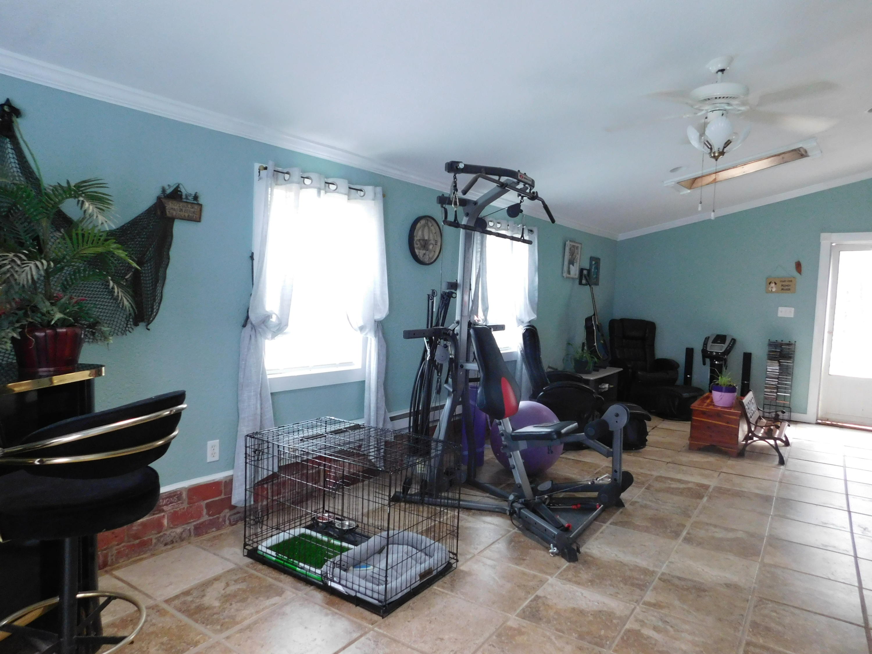 1463 Stripers Cove Road Goodview, VA 24095 - Photo 18 of 44 a view of a room with gym equipment