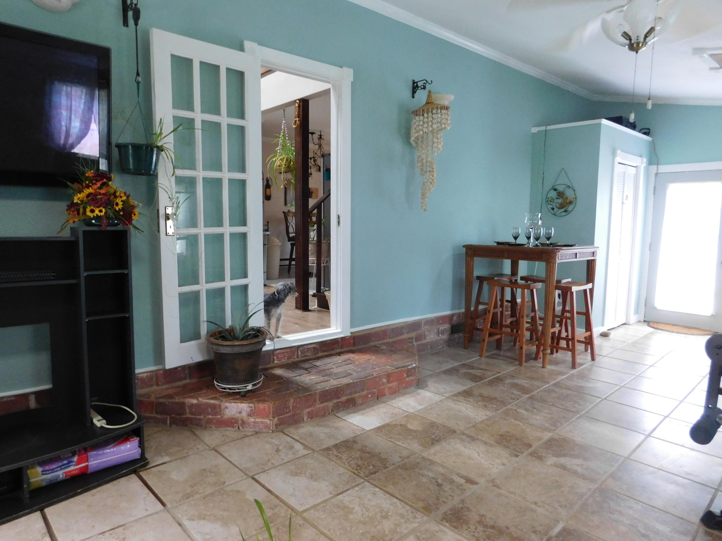 1463 Stripers Cove Road Goodview, VA 24095 - Photo 20 of 44 a view of livingroom with furniture and floor to ceiling window