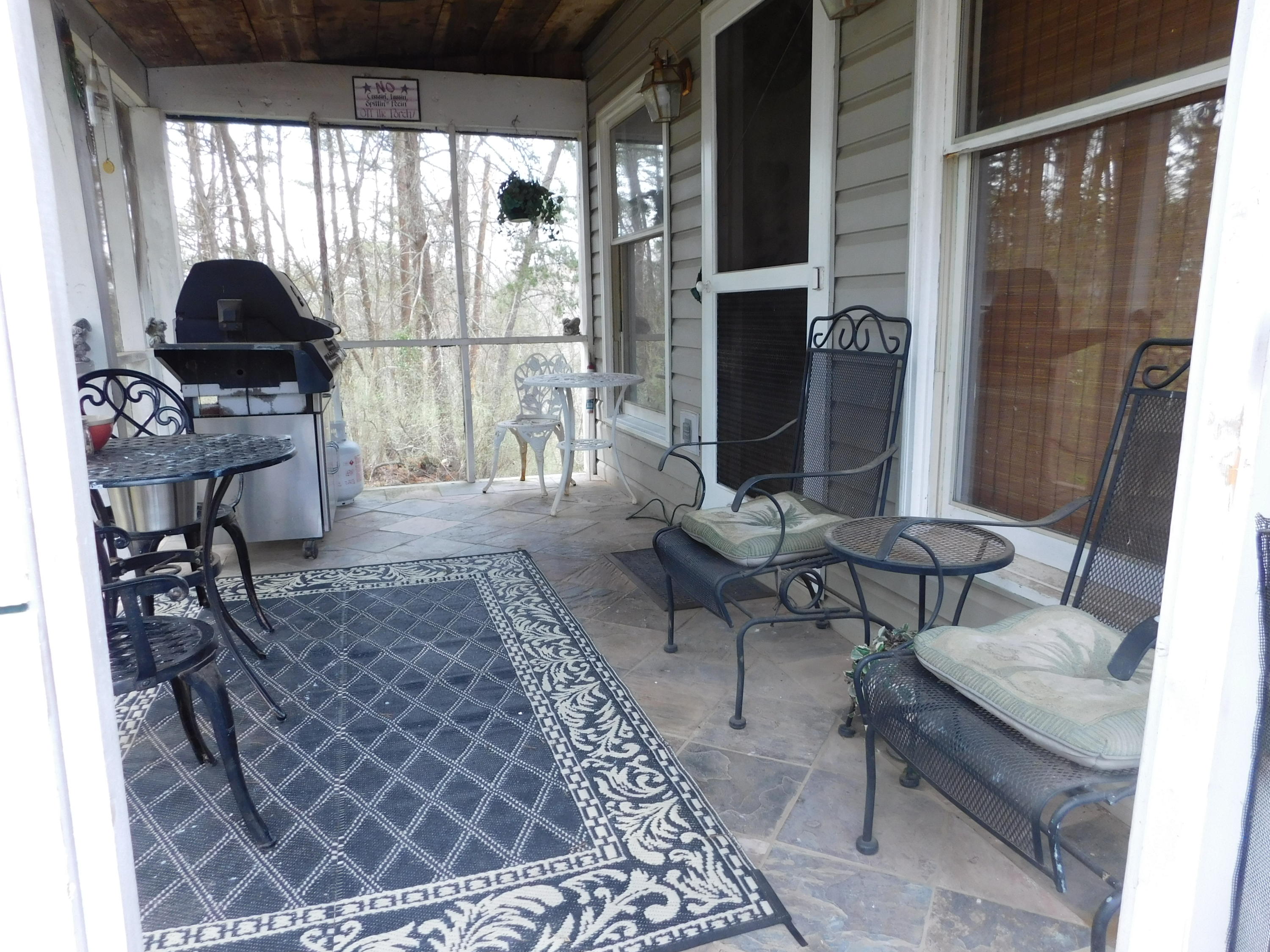 1463 Stripers Cove Road Goodview, VA 24095 - Photo 3 of 44 a living room with furniture and a floor to ceiling window