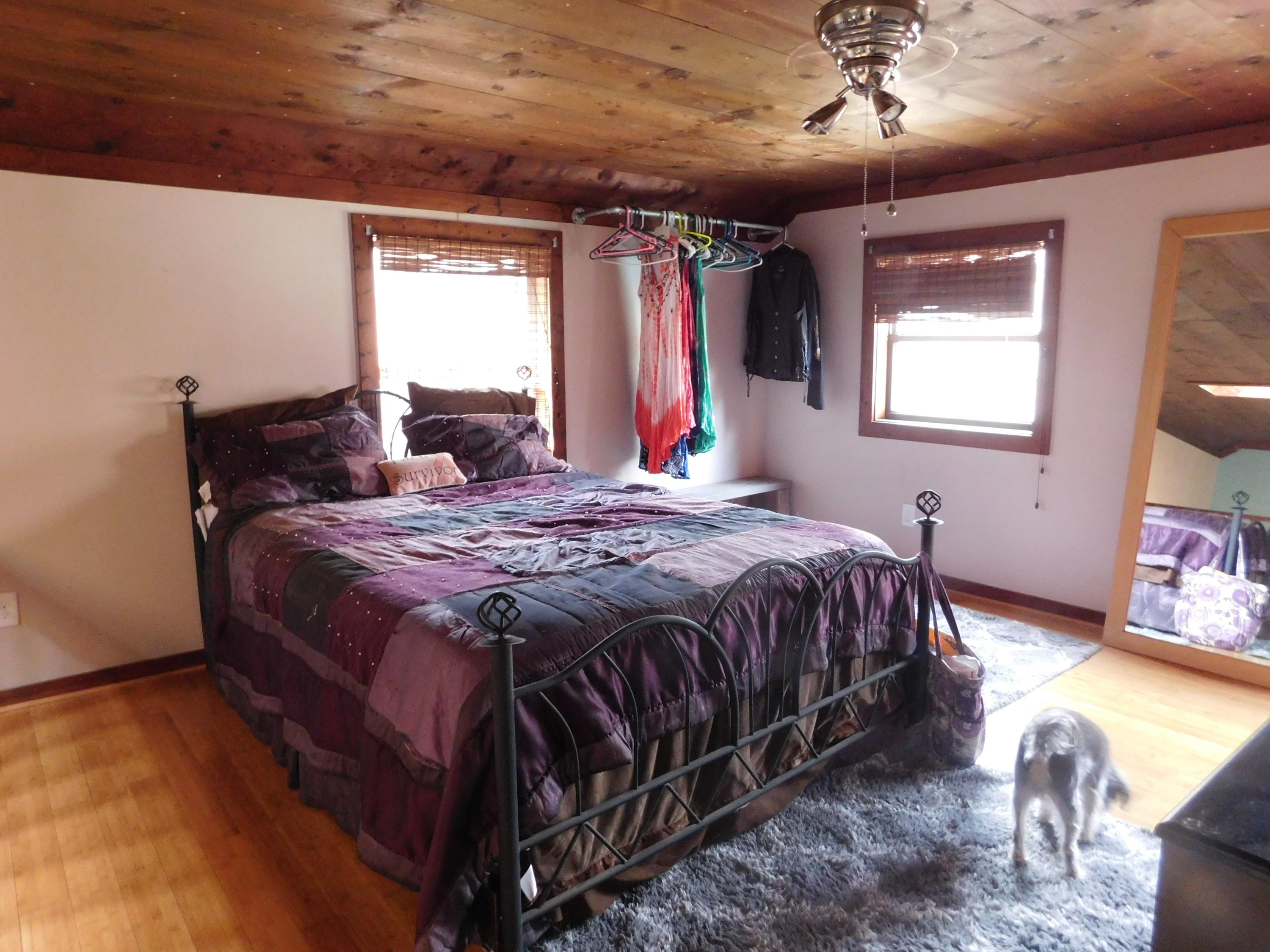 1463 Stripers Cove Road Goodview, VA 24095 - Photo 32 of 44 a bed sitting in a bedroom next to a window