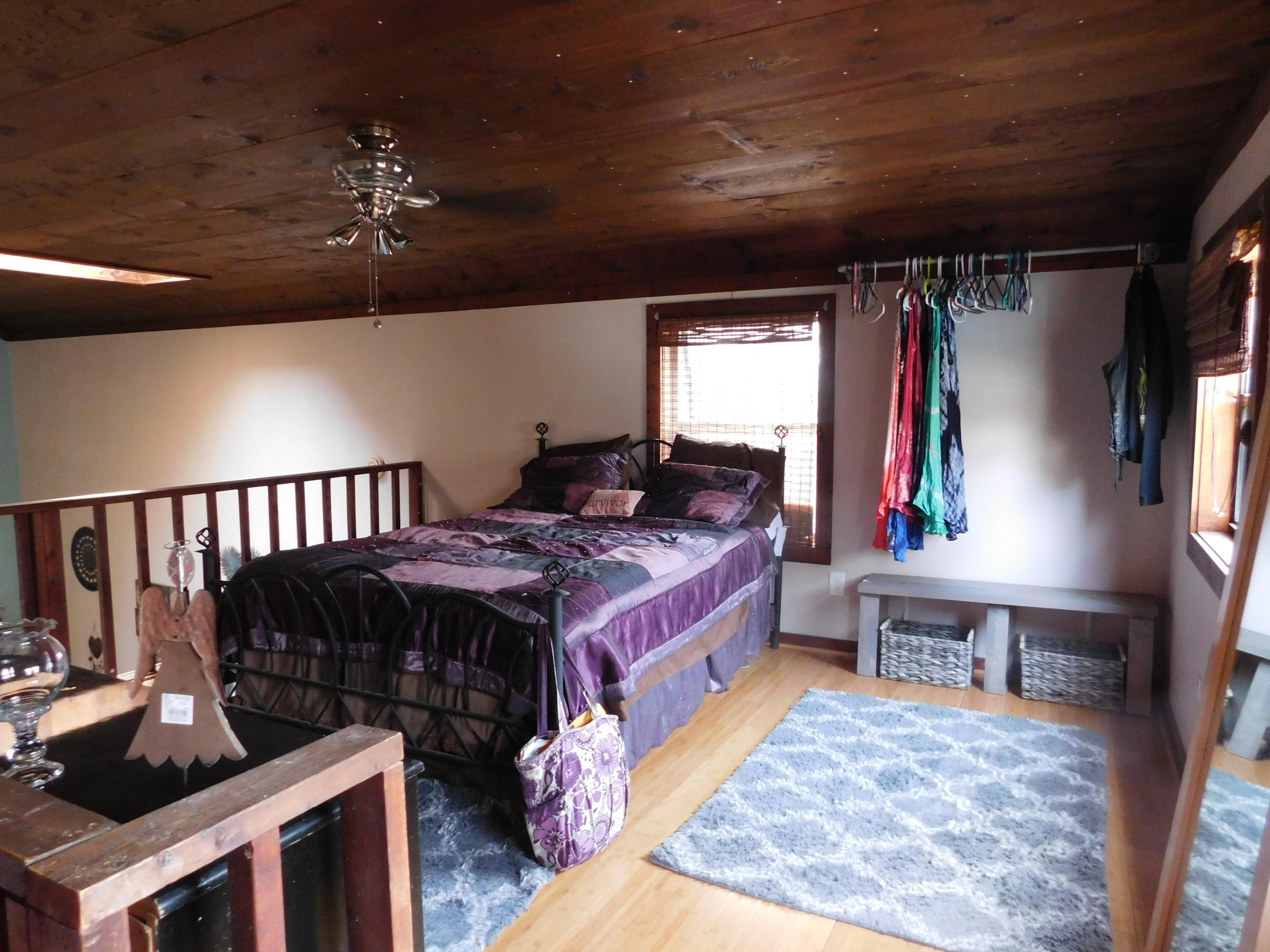 1463 Stripers Cove Road Goodview, VA 24095 - Photo 33 of 44 a bed room with a bed window and a table in it