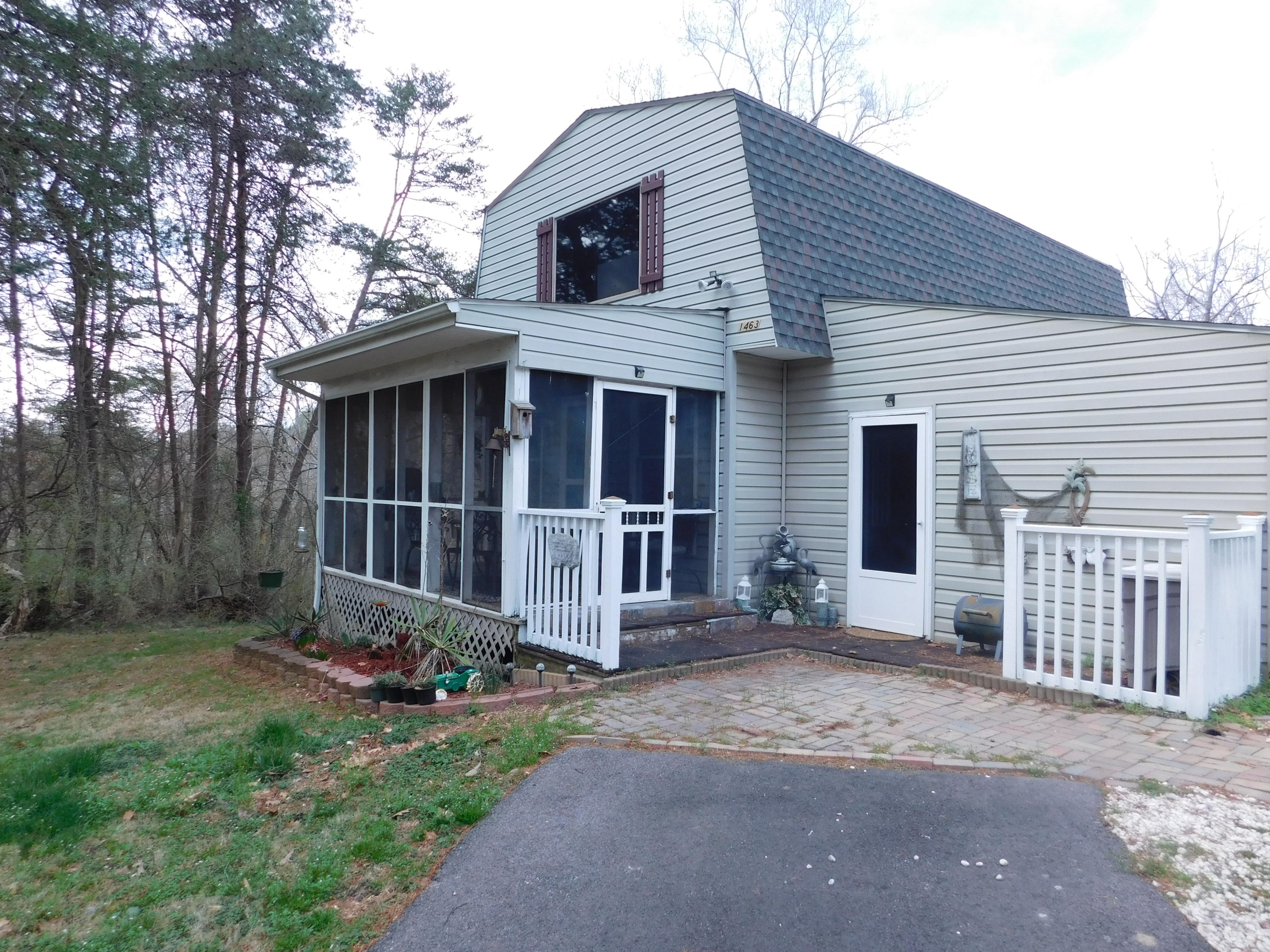 1463 Stripers Cove Road Goodview, VA 24095 - Photo 38 of 44 a front view of a house with garden