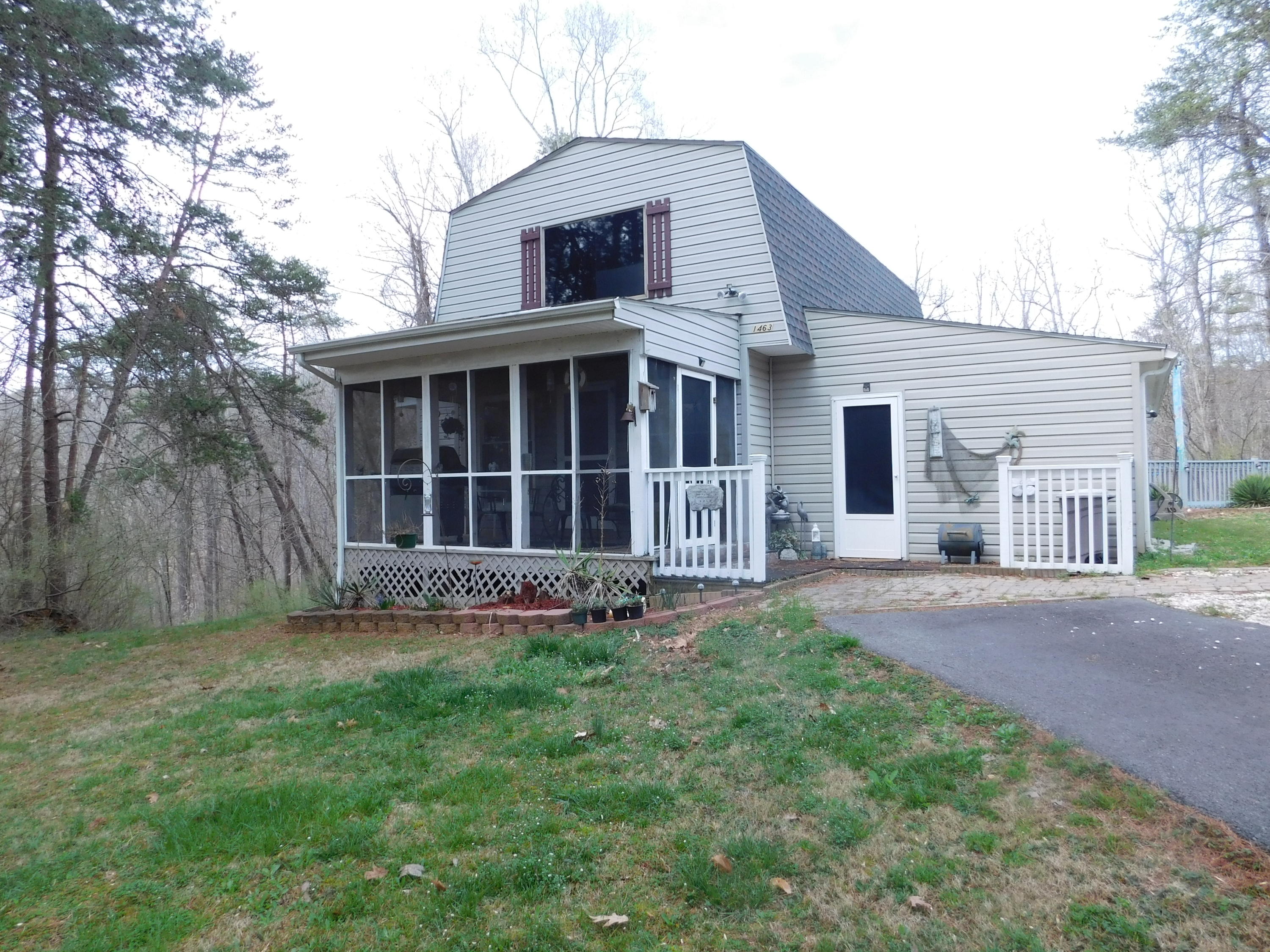 1463 Stripers Cove Road Goodview, VA 24095 - Photo 39 of 44 a view of a house with a yard and large tree