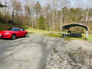 1463 Stripers Cove Road Goodview, VA 24095 - Photo 44 of 44 a backyard of a house with barbeque oven