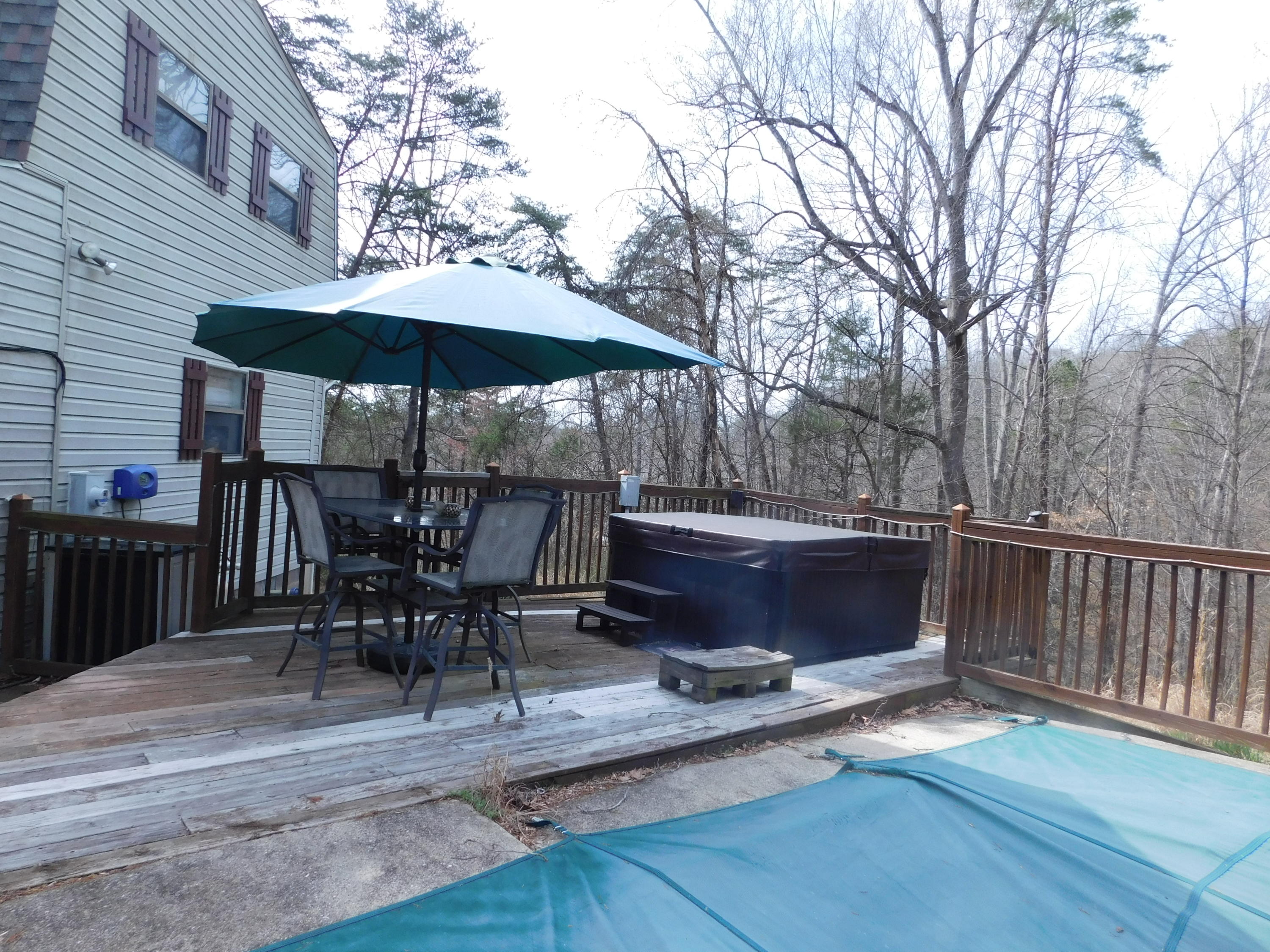 1463 Stripers Cove Road Goodview, VA 24095 - Photo 6 of 44 a view of backyard with outdoor seating and trees