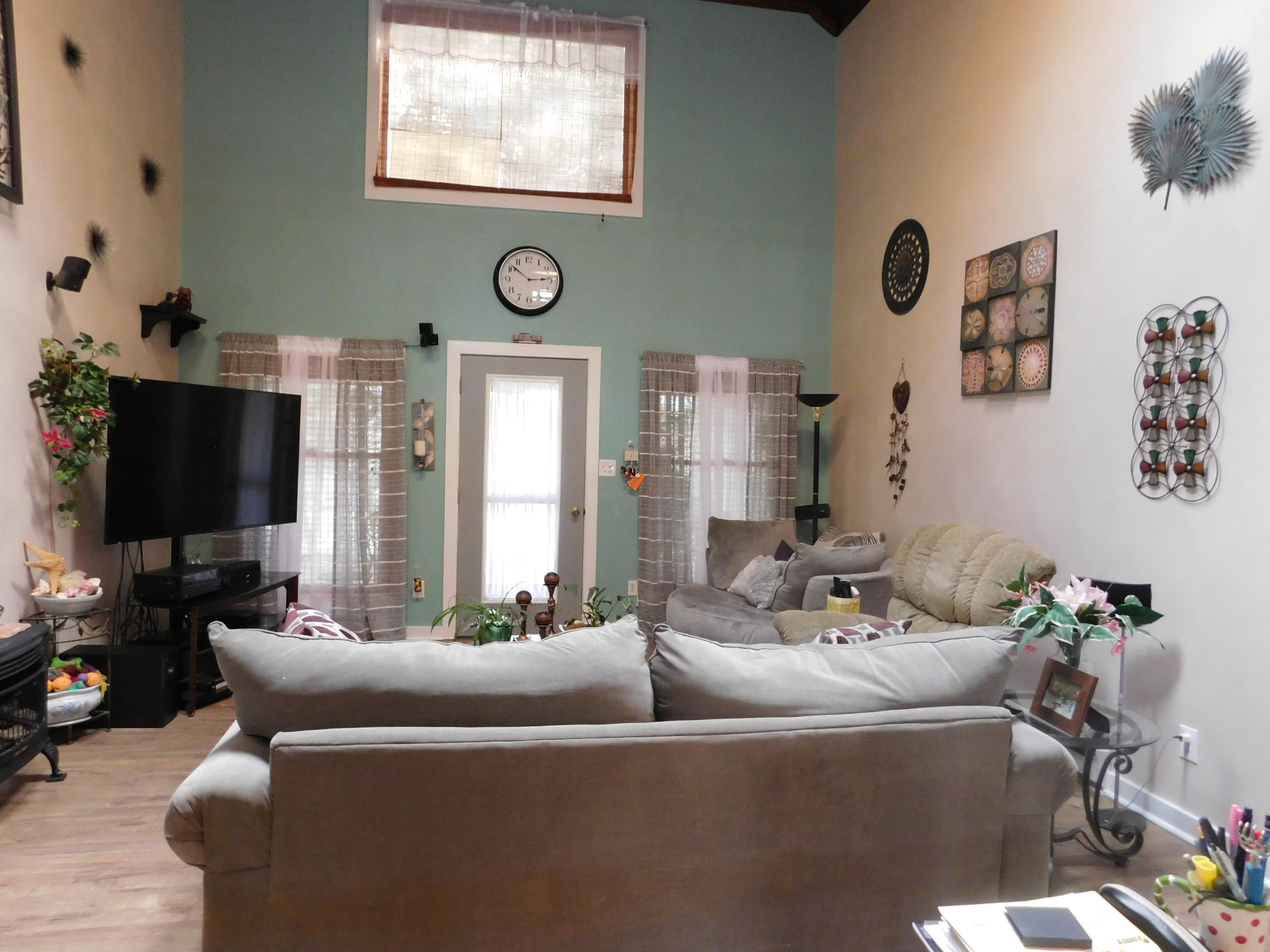 1463 Stripers Cove Road Goodview, VA 24095 - Photo 8 of 44 a living room with furniture and a flat screen tv