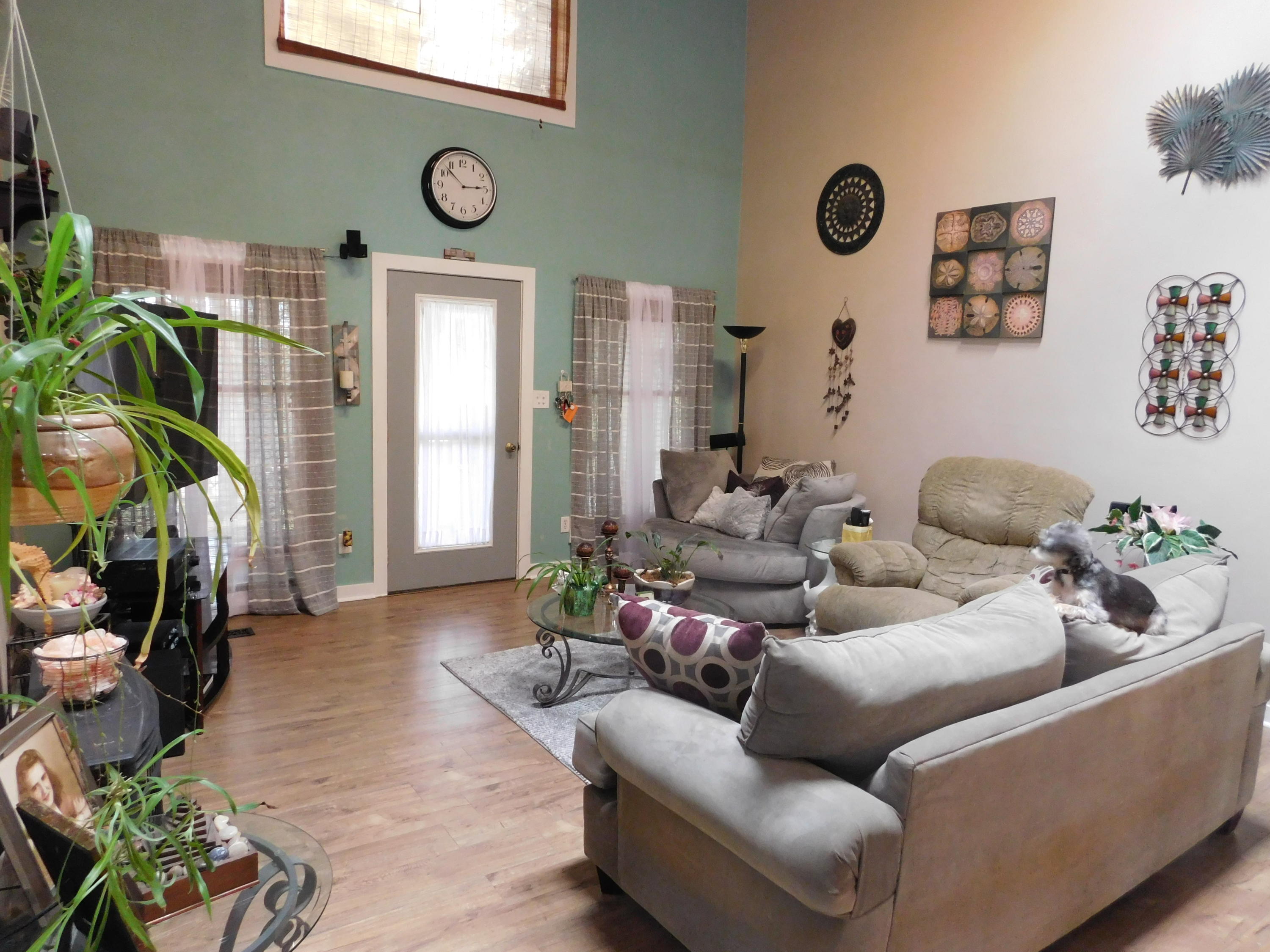 1463 Stripers Cove Road Goodview, VA 24095 - Photo 9 of 44 a living room with furniture and a large window