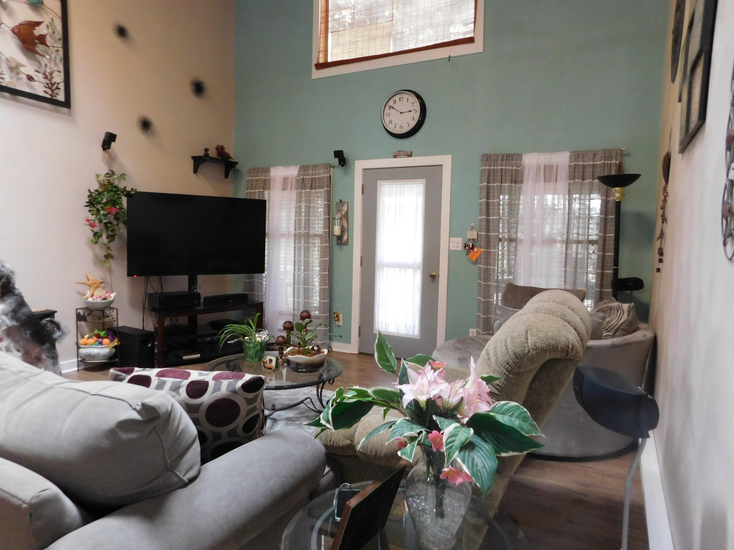 1463 Stripers Cove Road Goodview, VA 24095 - Photo 10 of 44 a living room with furniture and a flat screen tv