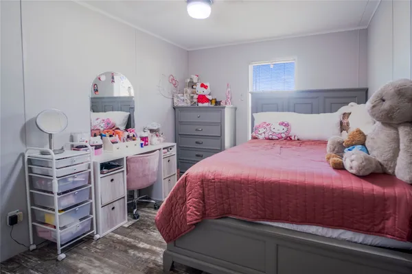 a bedroom with a bed and cabinets