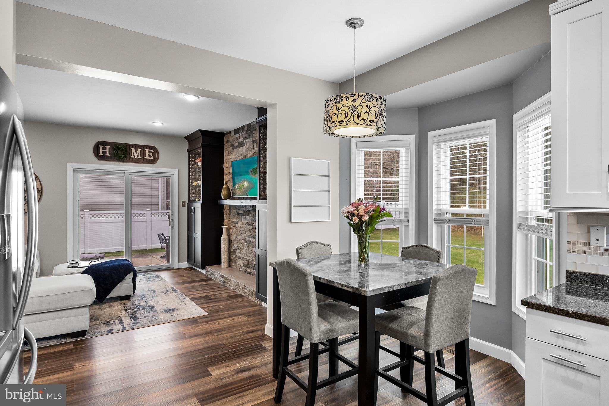53 Cranberry Lane Delran, NJ 08075 - Photo 11 of 33 a dining room with furniture a chandelier and wooden floor