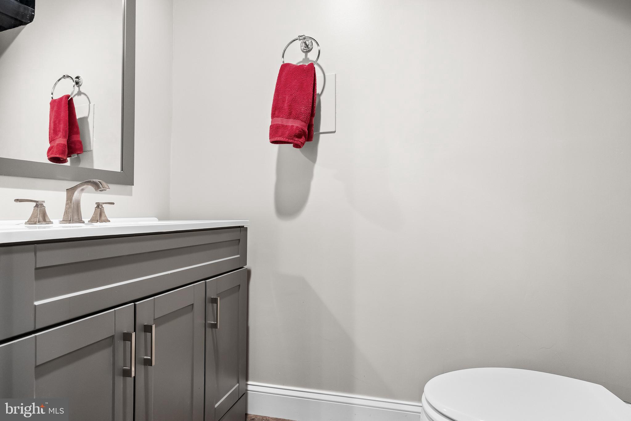 53 Cranberry Lane Delran, NJ 08075 - Photo 29 of 33 a bathroom with a sink vanity mirror and toilet