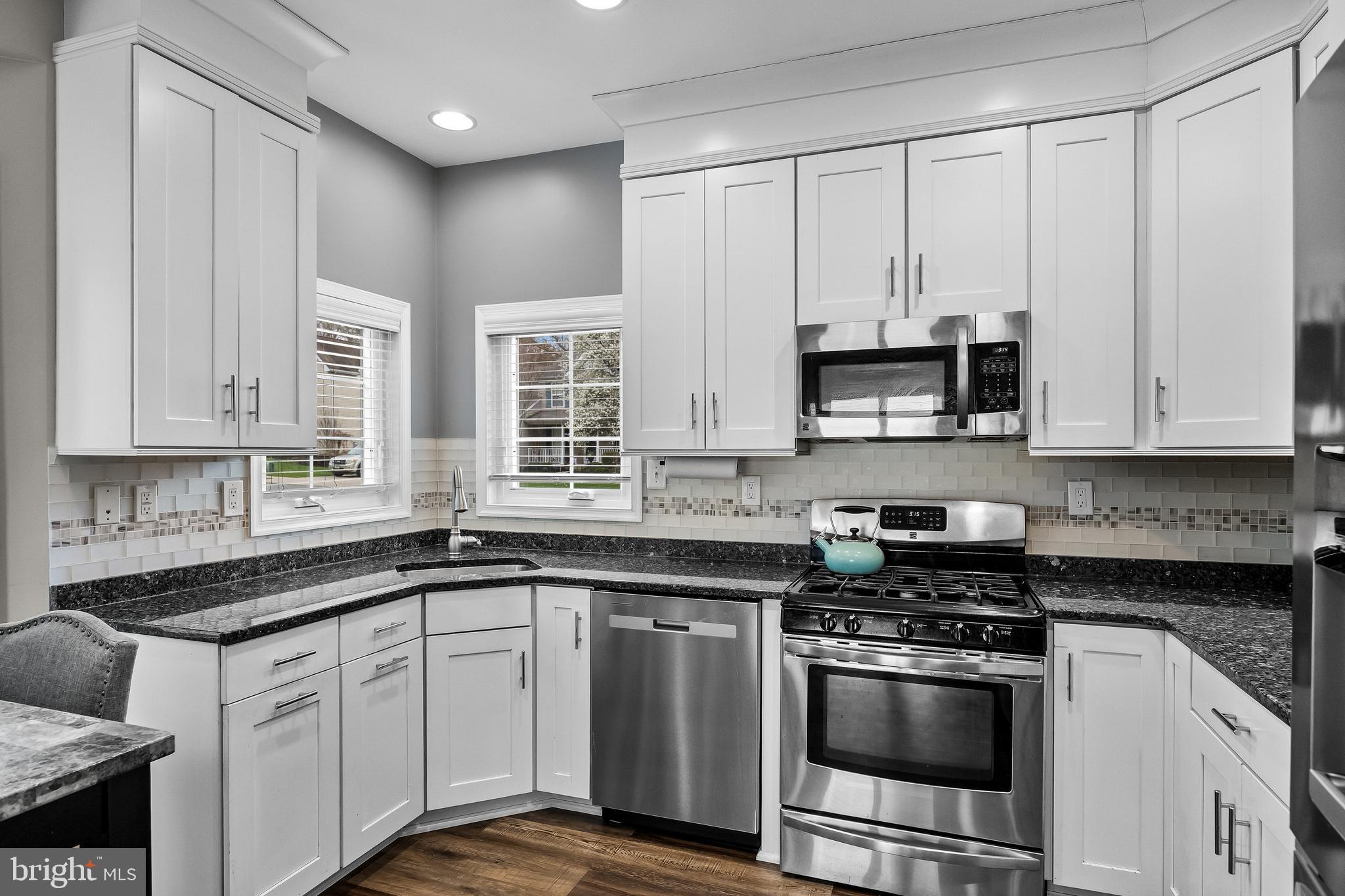 53 Cranberry Lane Delran, NJ 08075 - Photo 8 of 33 a kitchen with stainless steel appliances granite countertop white cabinets a sink and dishwasher