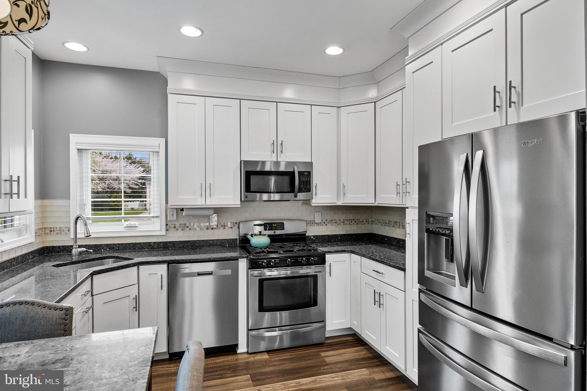 53 Cranberry Lane Delran, NJ 08075 - Photo 10 of 33 a kitchen with stainless steel appliances white cabinets and a refrigerator