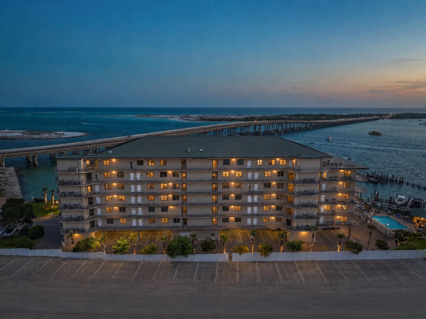 5 Calhoun Avenue, Unit 504 Destin, FL 32541 - Photo 64 of 64 Twilight Rear Elevation with Bridge View