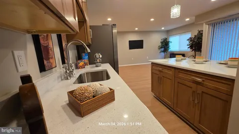a kitchen with a sink and a refrigerator