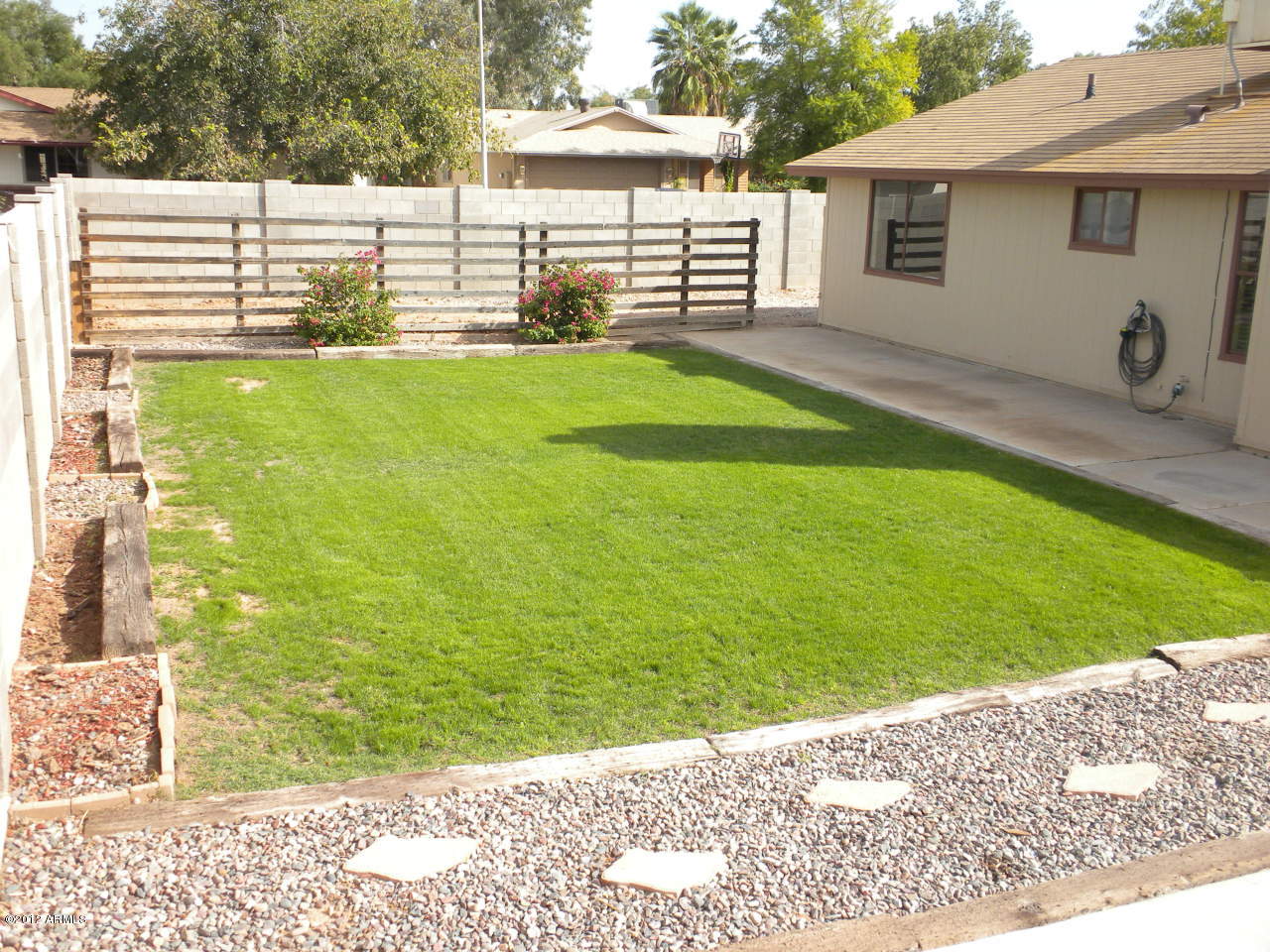 1506 West Colt Road Chandler, AZ 85224 - Photo 19 of 27 a view of a backyard with a sitting area