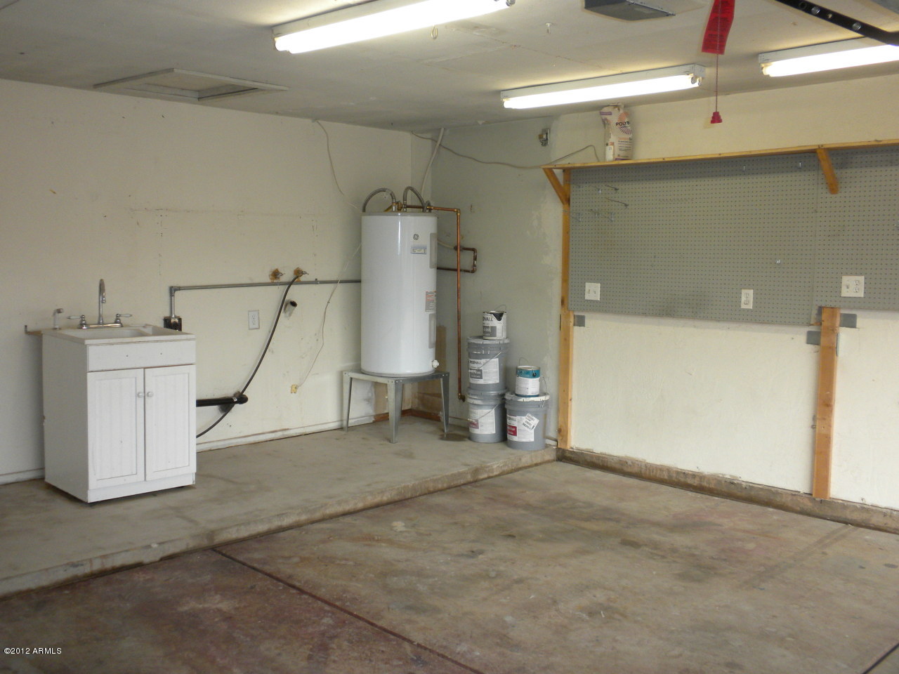 1506 West Colt Road Chandler, AZ 85224 - Photo 22 of 27 a view of a storage & utility room with two washing machine