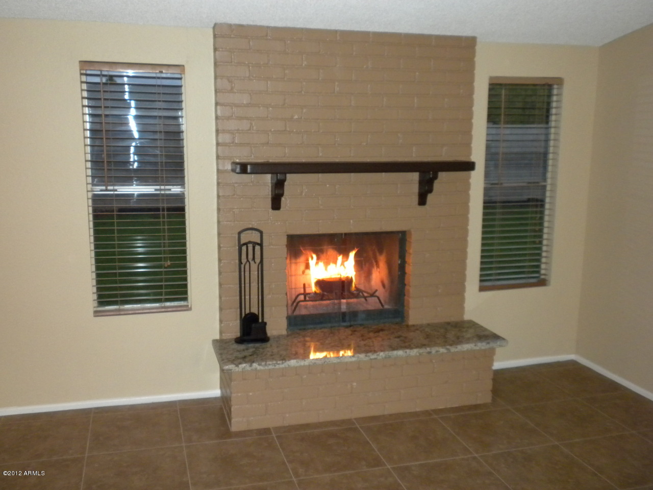 1506 West Colt Road Chandler, AZ 85224 - Photo 27 of 27 a view of a livingroom with a fireplace and window