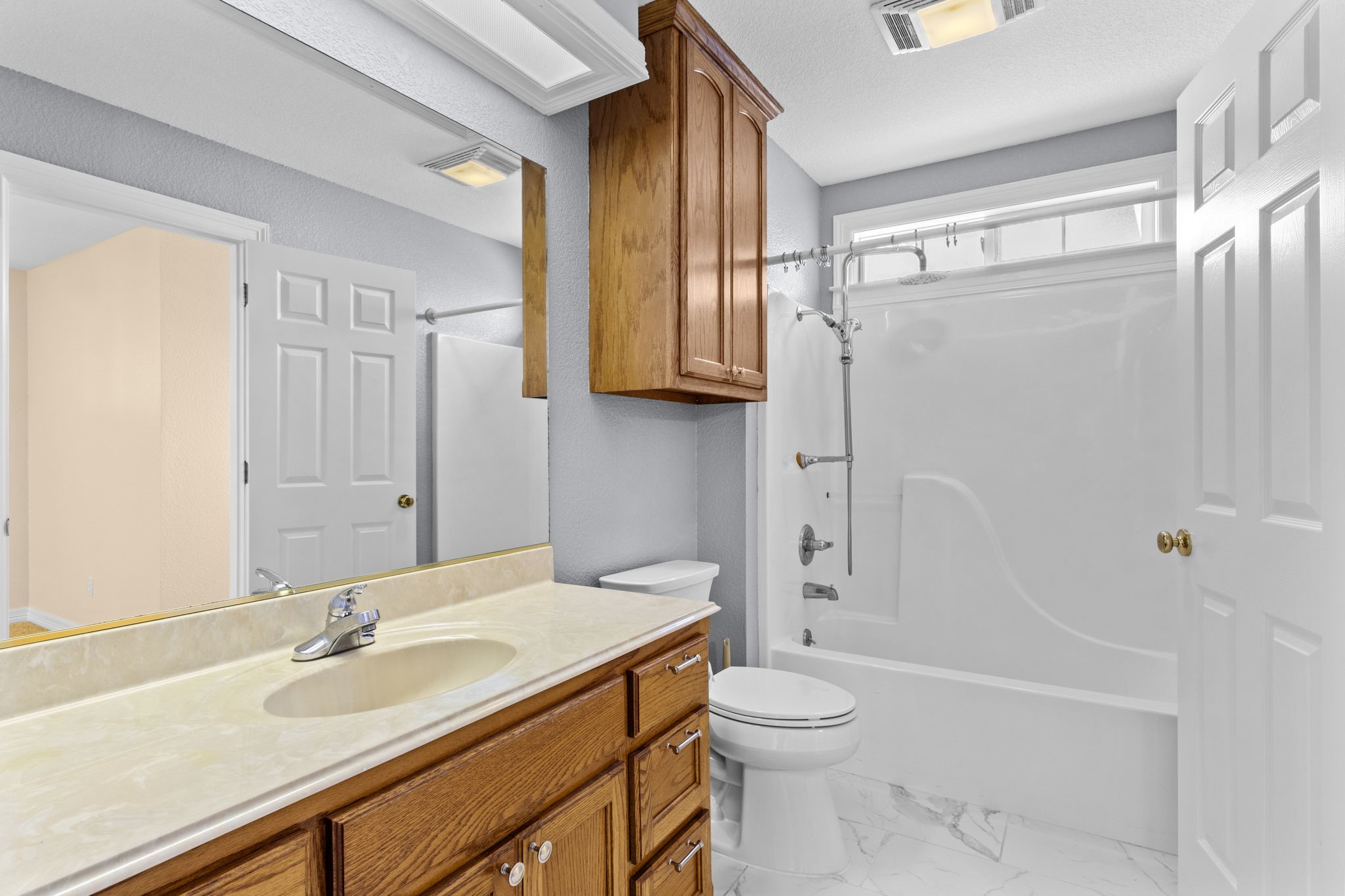 900 Southwind Port Arthur, TX 77640 - Photo 15 of 38 a bathroom with a granite countertop sink toilet and shower