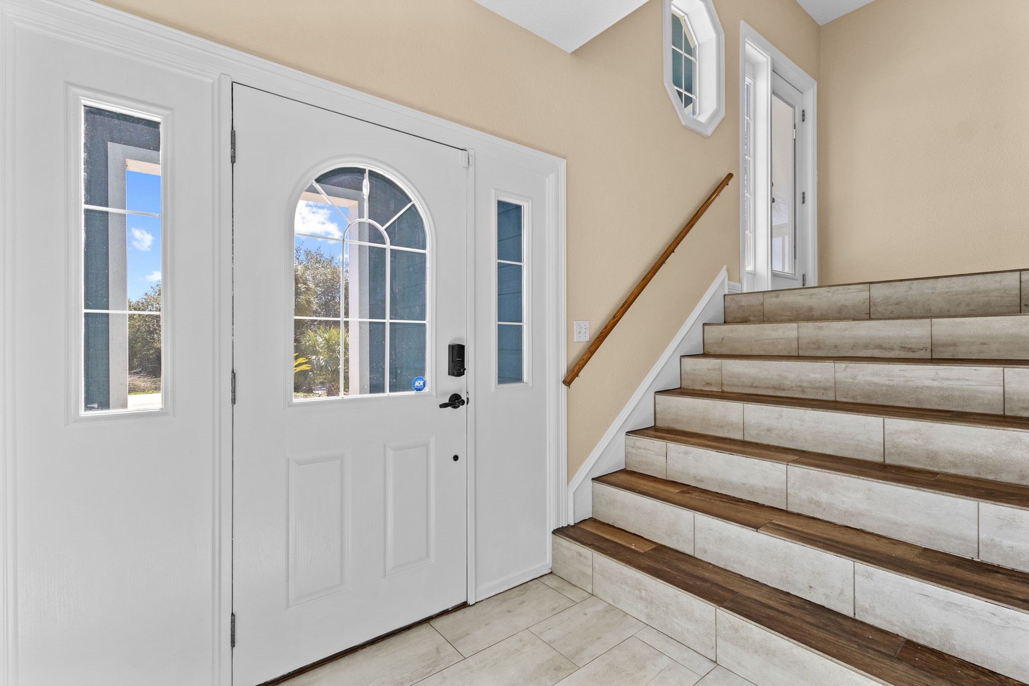 900 Southwind Port Arthur, TX 77640 - Photo 22 of 38 a view of staircase with lots of frames on wall and a window
