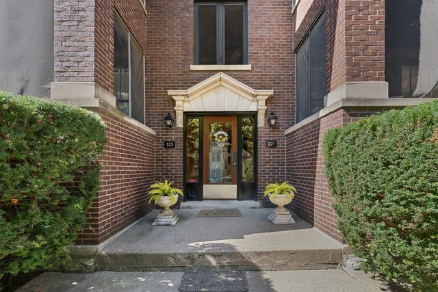 a front view of a house with outdoor seating